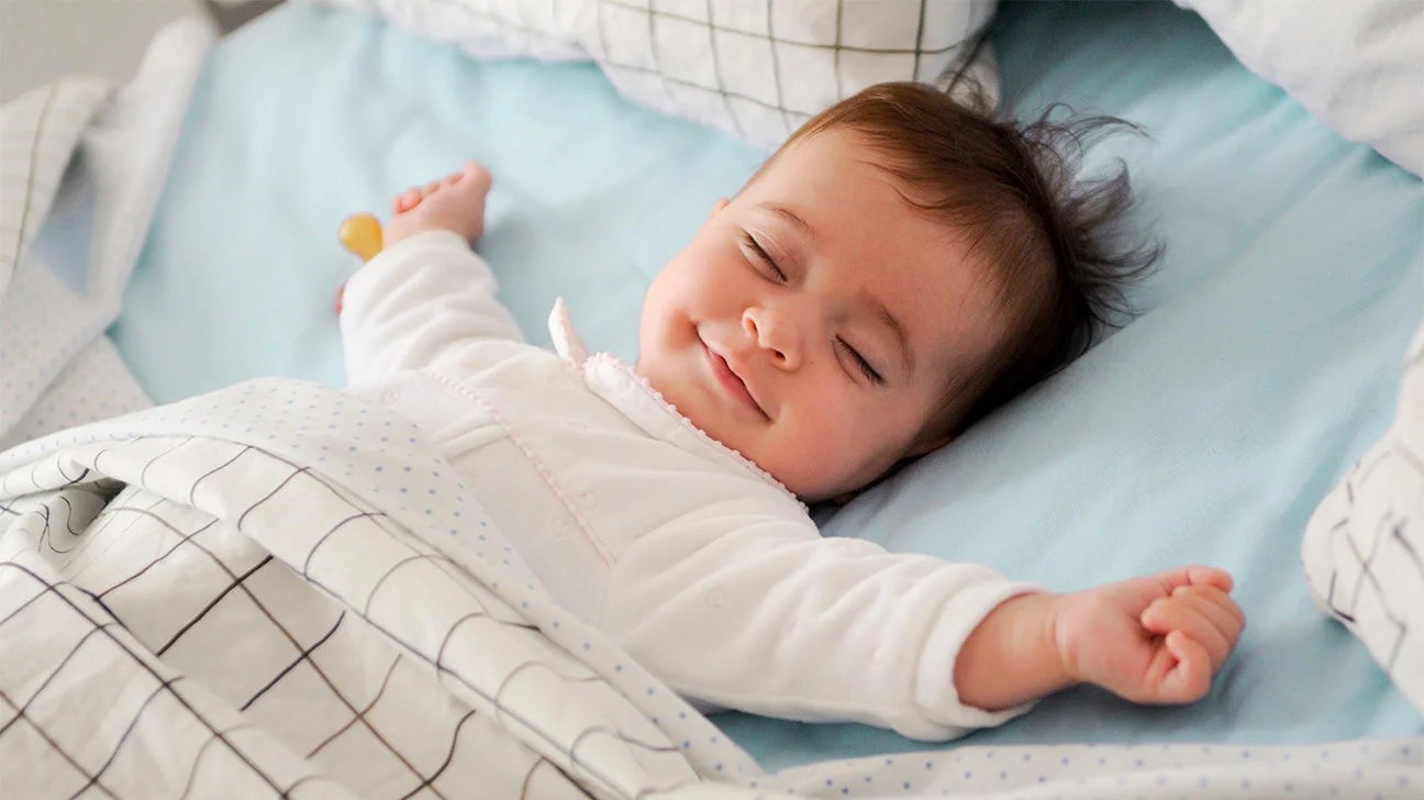 When Is It Safe For My Baby To Sleep With A Blanket