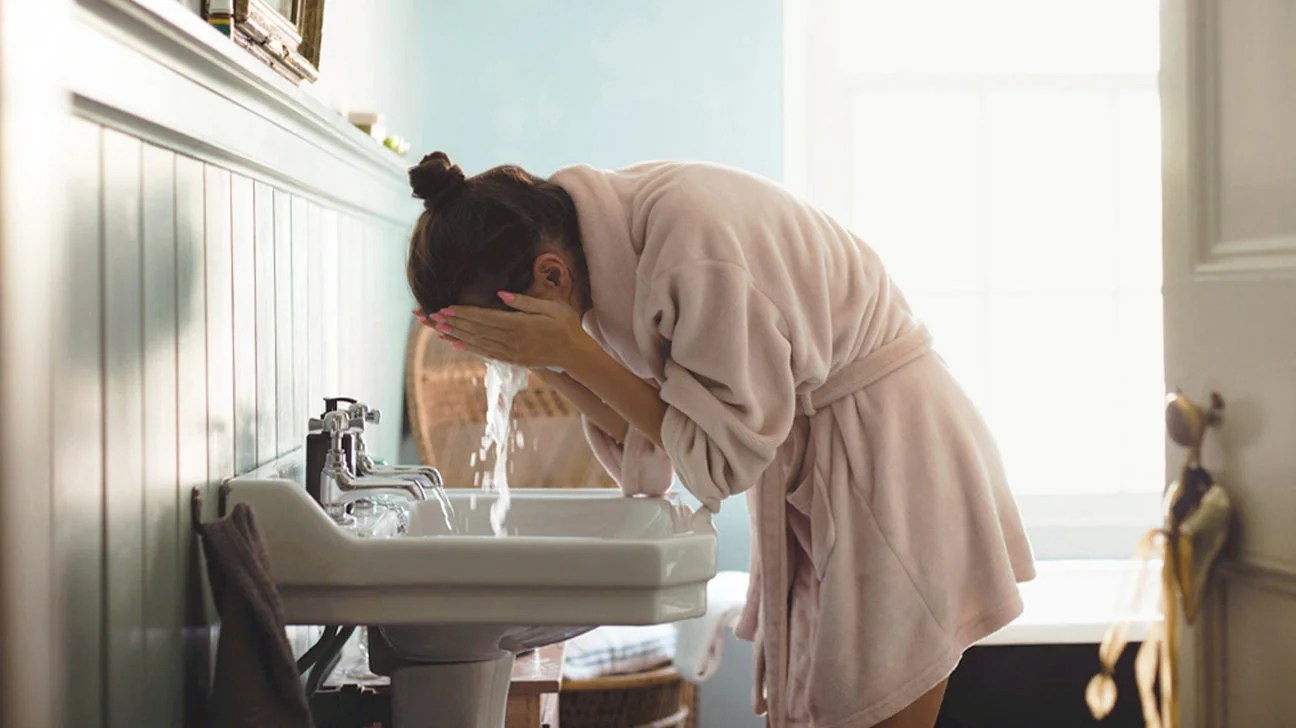 2 Micellar Waters for All Skin Types 2 Woman washing her face in the bathroom