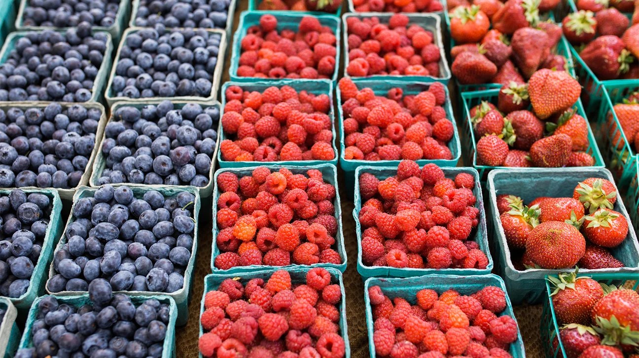 fresh blueberries, raspberries, and strawberries in containers