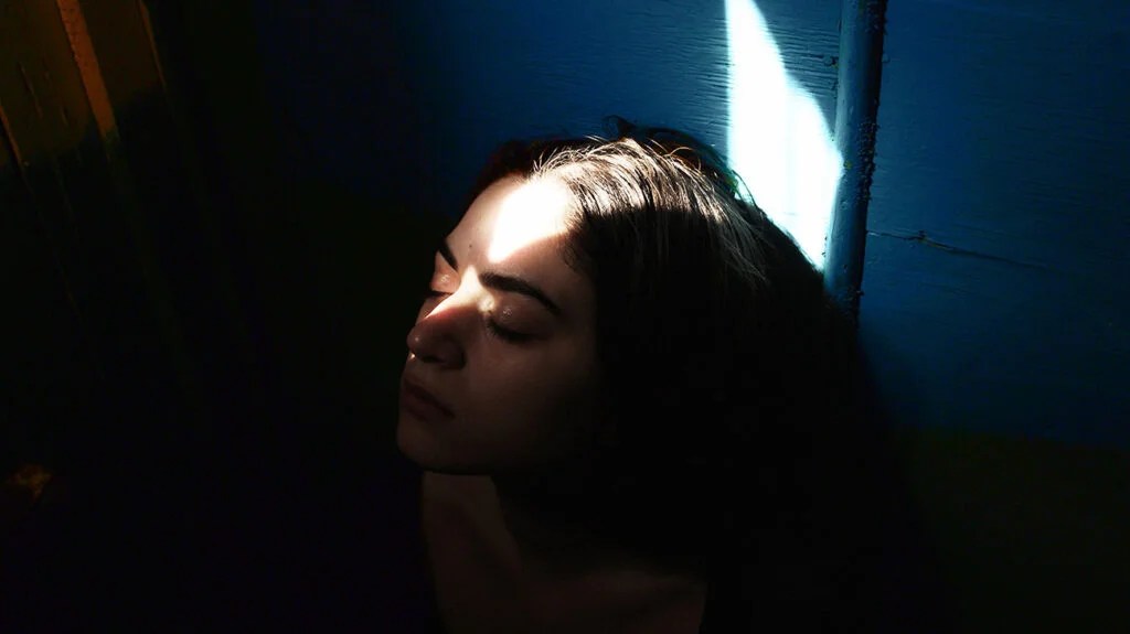 Close-Up Portrait Of Young Woman thinking about PTSD