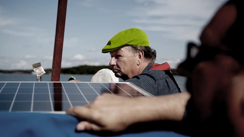 a father and son on a boat