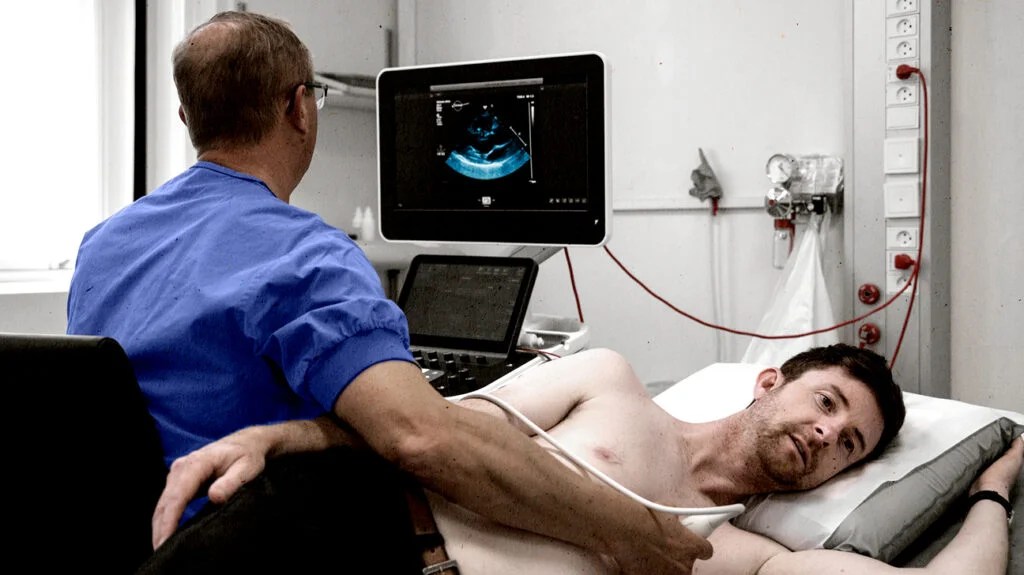 A male patient undergoing an echocardiogram