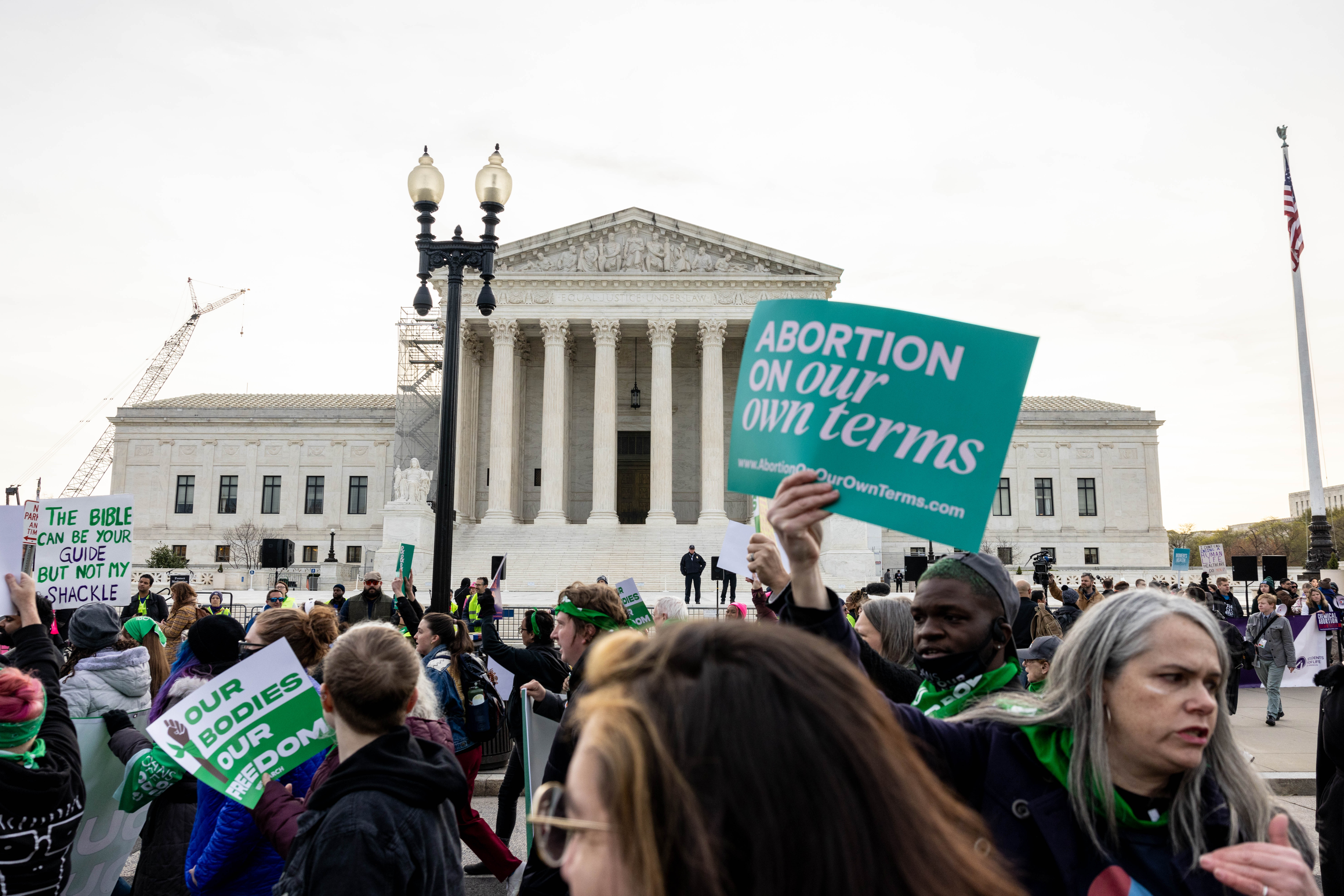 Demonstrators gather in front of the Supreme Court as the court hears oral arguments in the case of the U.S. Food and Drug Administration v. Alliance for Hippocratic Medicine.