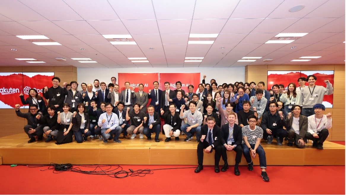The OpenAI team taking pictures with Rakuten employees after the talk session.