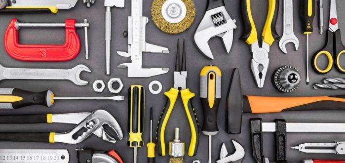 Tool Set Of Pliers, Wrenches, Hammer, Clamps, Screwdrivers On Gr How To Save Money On Home Renovation