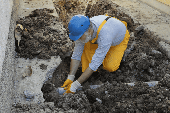 home-renovation-plumber-fixing-sewerage-pipe Plumbing emergency Services