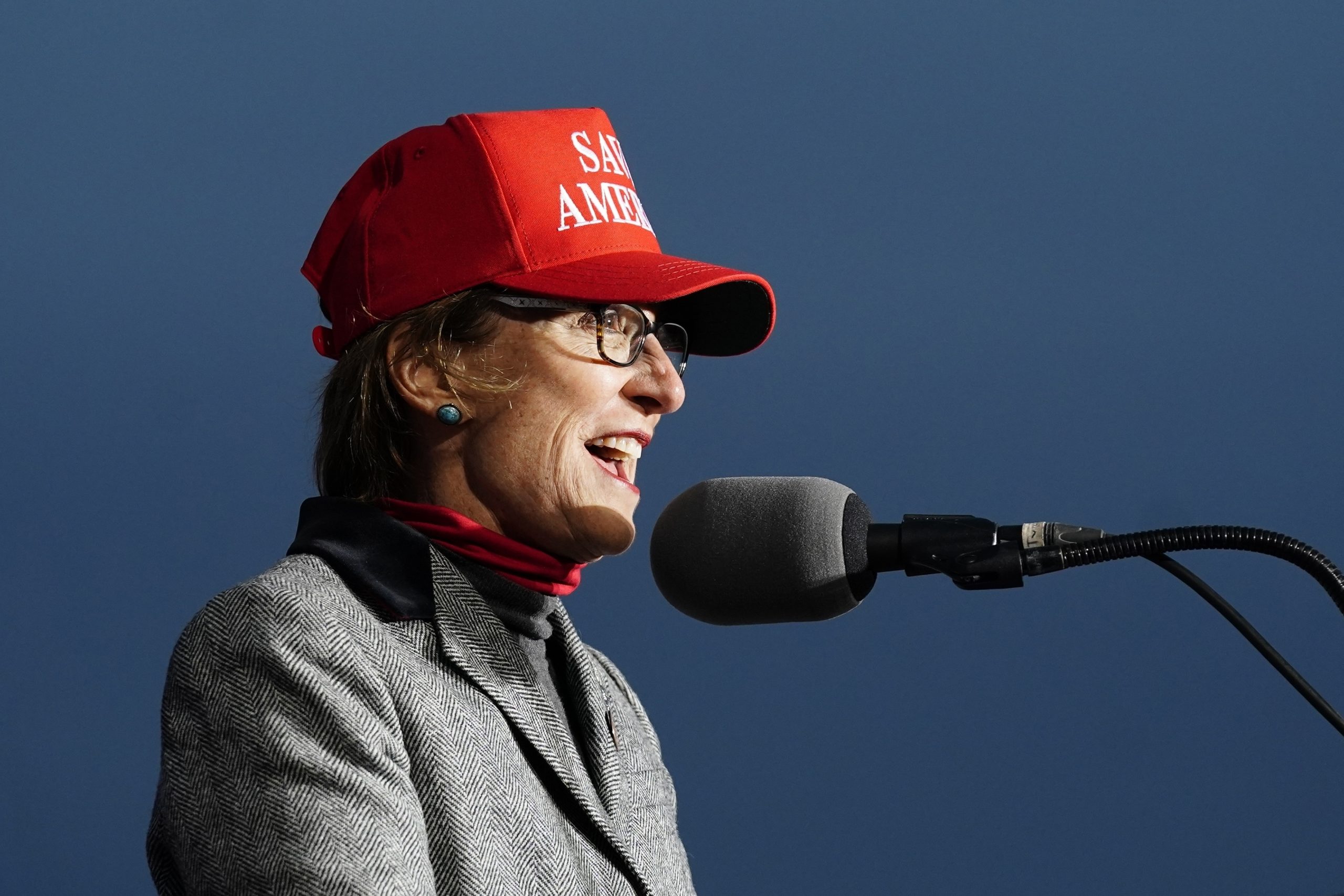 Arizona state Sen. Wendy Rogers wears a red Save America baseball cap as she speaks.