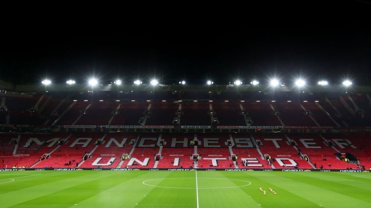 Old Trafford by night - home to Premier League football team Manchester United