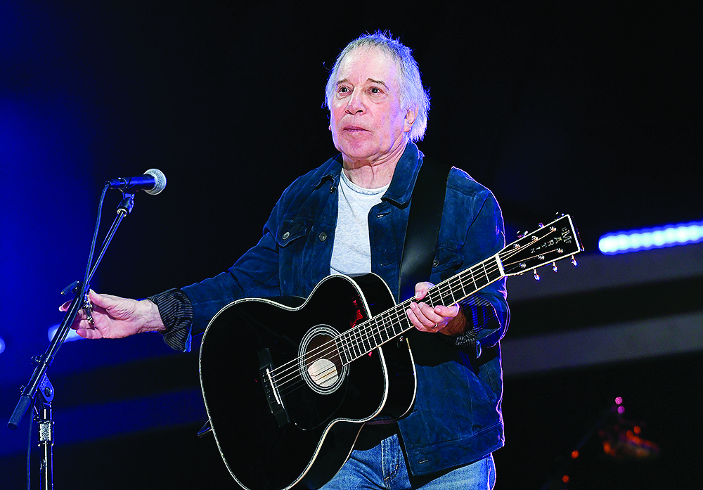 Le chanteur Paul Simon se glissera dans Canfield au profit de Ryan
