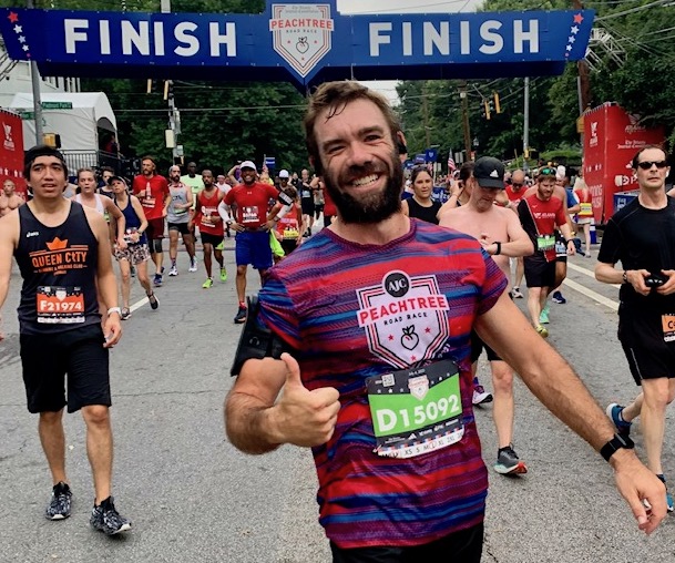 2023 Peachtree Road Race runners at finish line