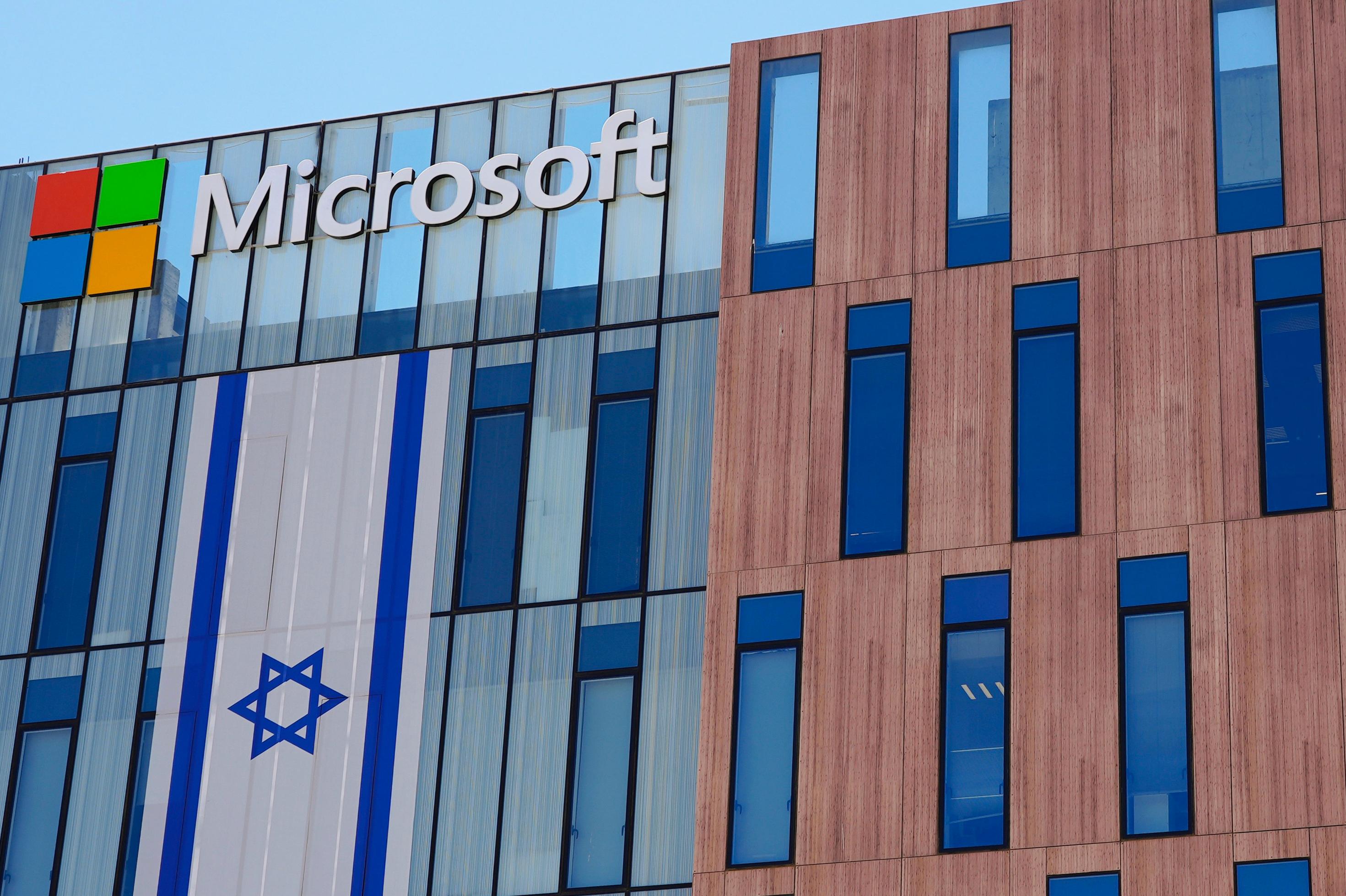 An Israeli flag is draped over the Microsoft offices in a building in the Gav Yam technology park in Beersheba, Israel, on Thursday, May 30, 2024. (AP Photo/Sam Mednick)