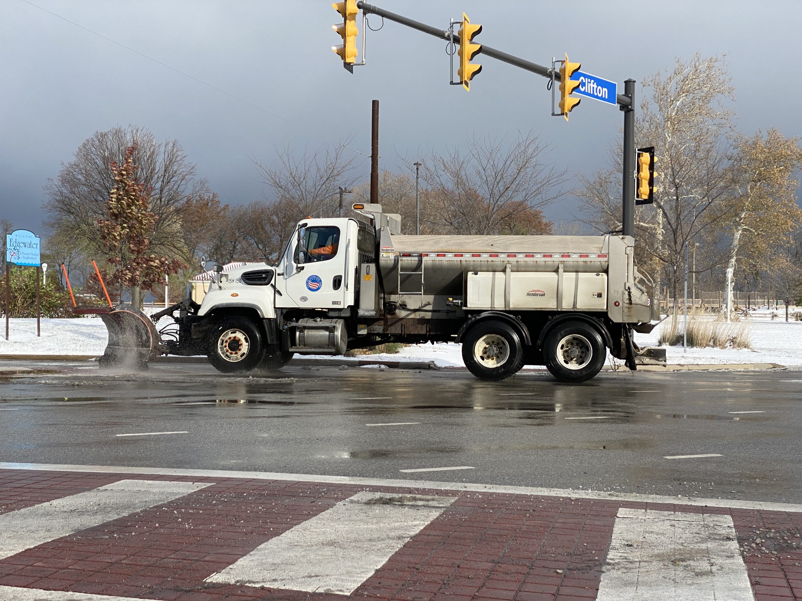 A Cleveland plow drives a route in the city's Edgewater neighborhood after snowfall in November 2022. Cleveland warming centers will open Monday, January 15, 2024 to help residents who need to escape the cold weather.