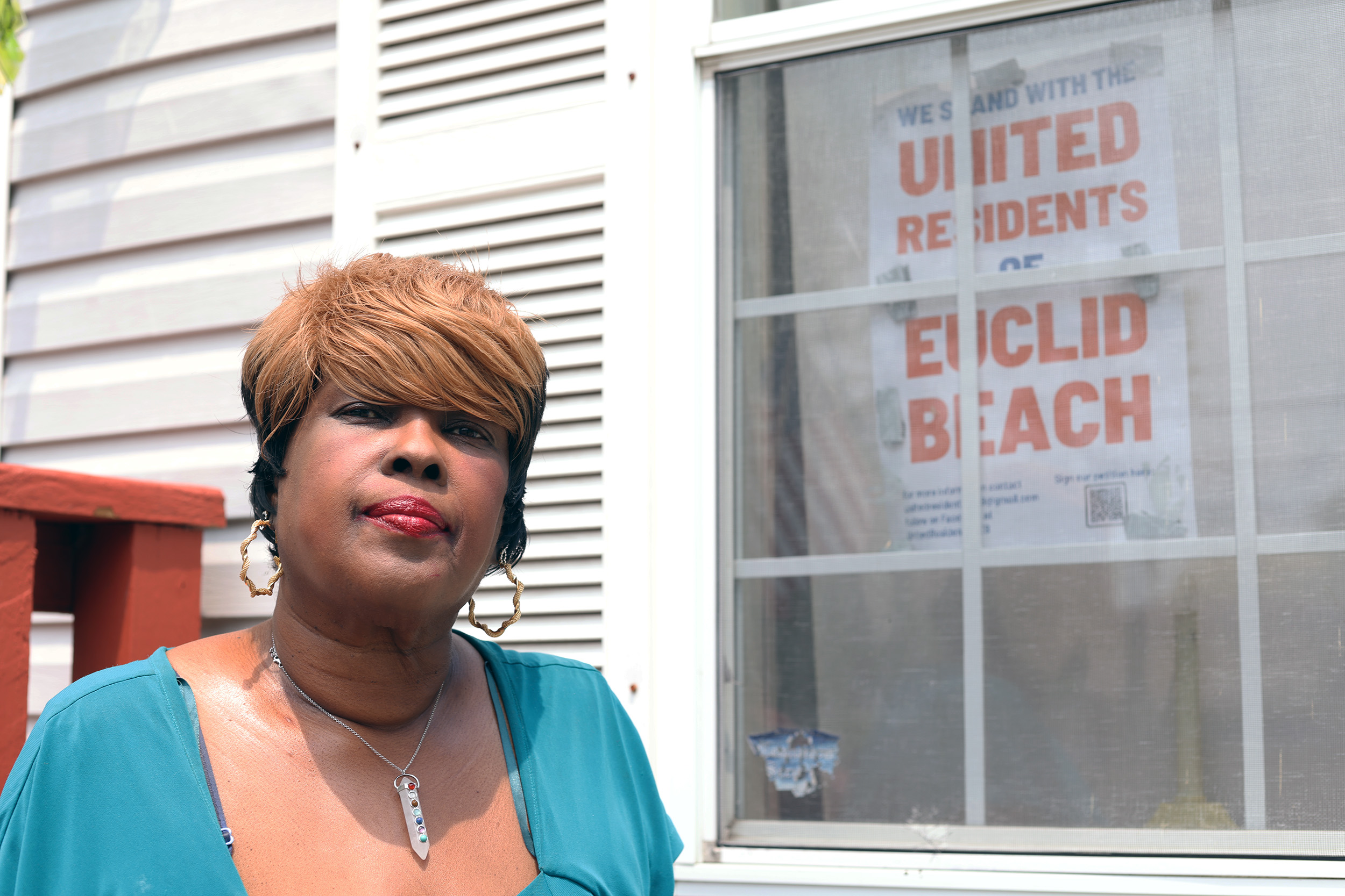 Carol McClain outside her home in Euclid Beach Mobile Home park. The Western Reserve Land Conservancy intends to close Euclid Beach Mobile Home park in the summer of 2024. The nonprofit will then give the land to Cleveland Metroparks, which will use it to upgrade and redevelop Euclid Beach Park into a major recreational attraction. Residents are fighting to keep their affordable housing near Lake Erie.