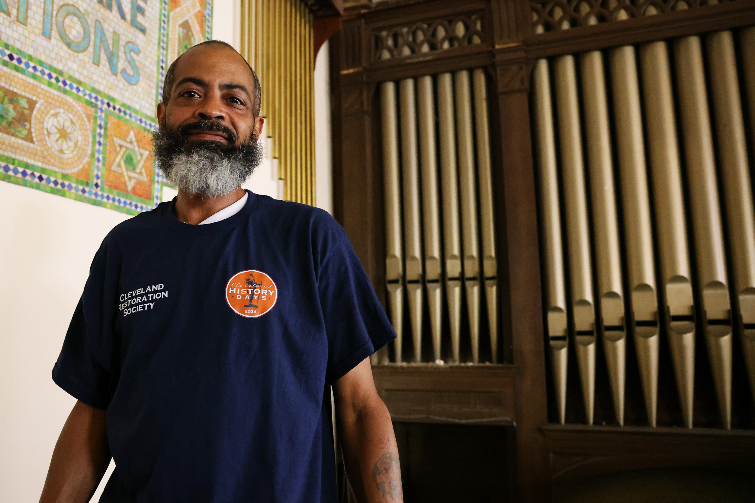 Church member Malcolm Prye guides visitors looking at the pipe organ and out over the sanctuary. He is a third-generation member of Liberty Hill Baptist.