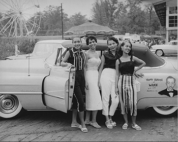 Four young African American women standing before a convertible automobile, Carr's Beach, Maryland, ca. 1958. Used with permission from WANN Radio Station Records, Archives Center, National Museum of American History, Smithsonian Institution, AC0800-0000005.