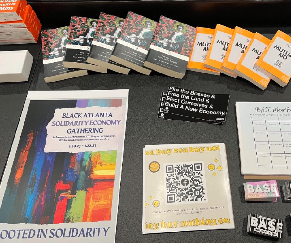 Endstate ATL's solidarity gathering table offerings including COVID tests and readings on mutual aid. Atlanta, Georgia, January 2023