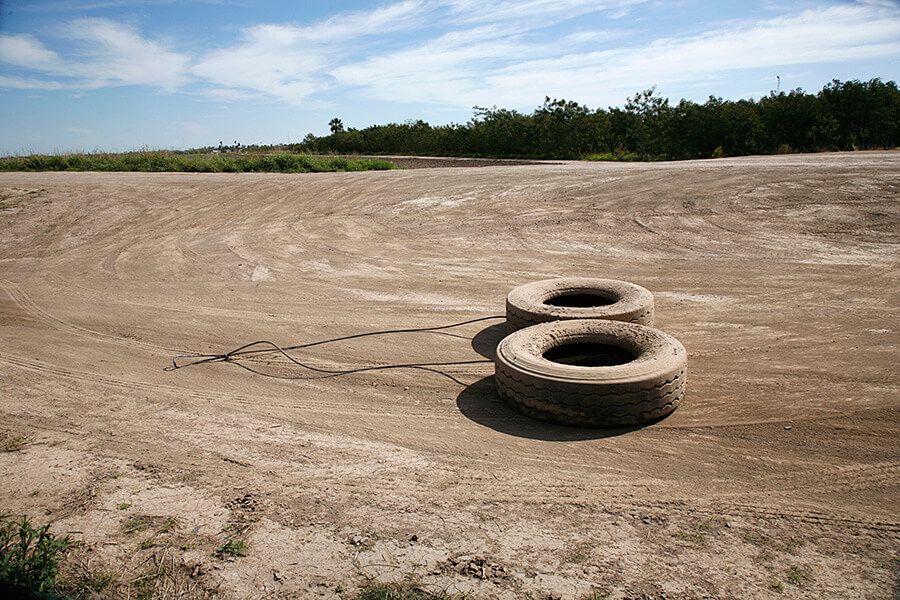 Susan Harbage Page, Tires dragged along roads by the Border Patrol to see fresh footprints left by immigrants, Brownsville, Texas, 2010.