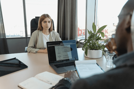 Job seeker using AI to write a compelling cover letter, preparing for an interview confidently & professionally.