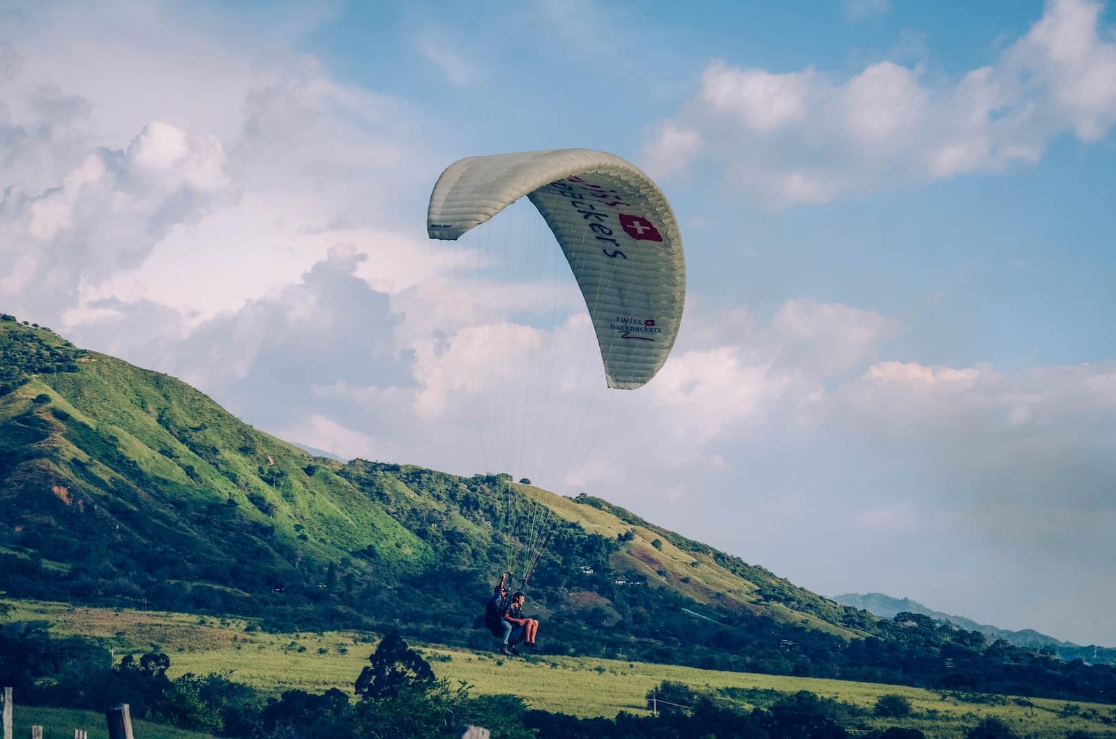 paraglider under blue sky-Adventure Tours And Activities