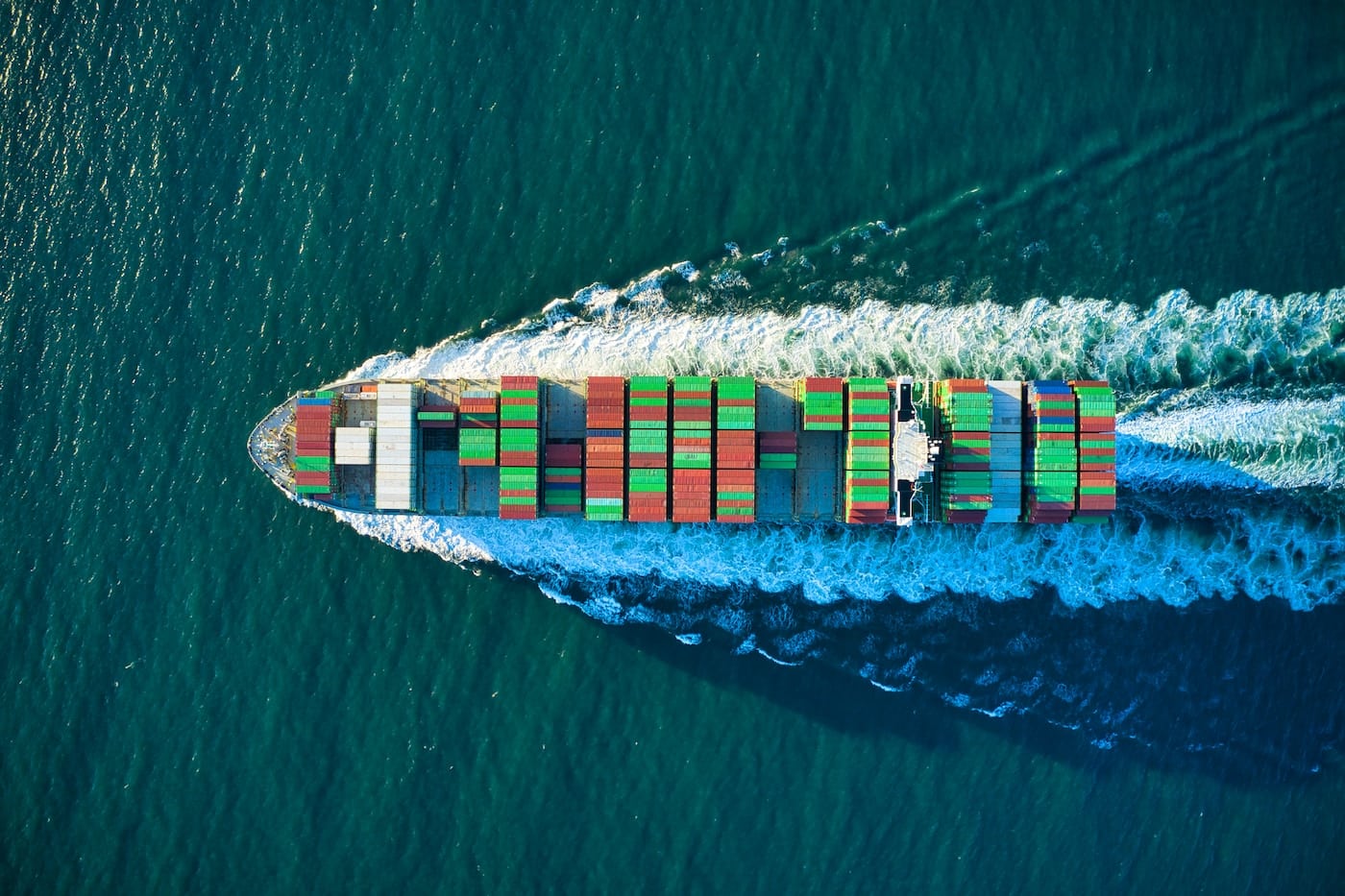 aerial view of blue and white boat on body of water during daytime-travel by boat