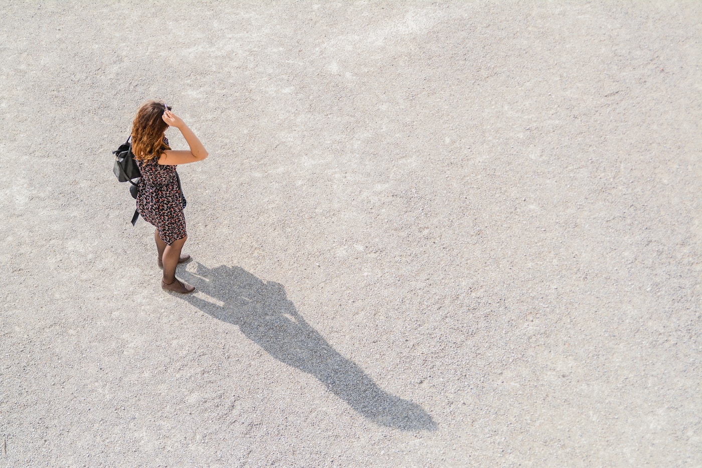 woman standing while carrying backpack-solo travel tips