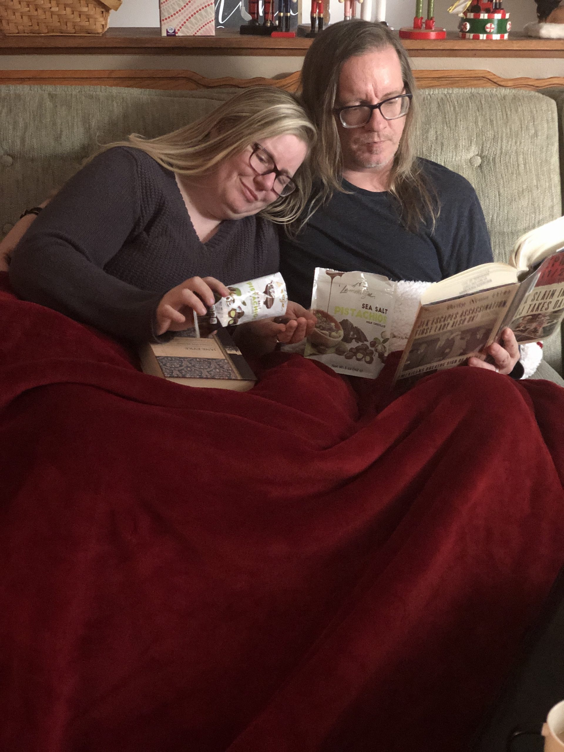 Snuggling on the couch and eating chocolates together