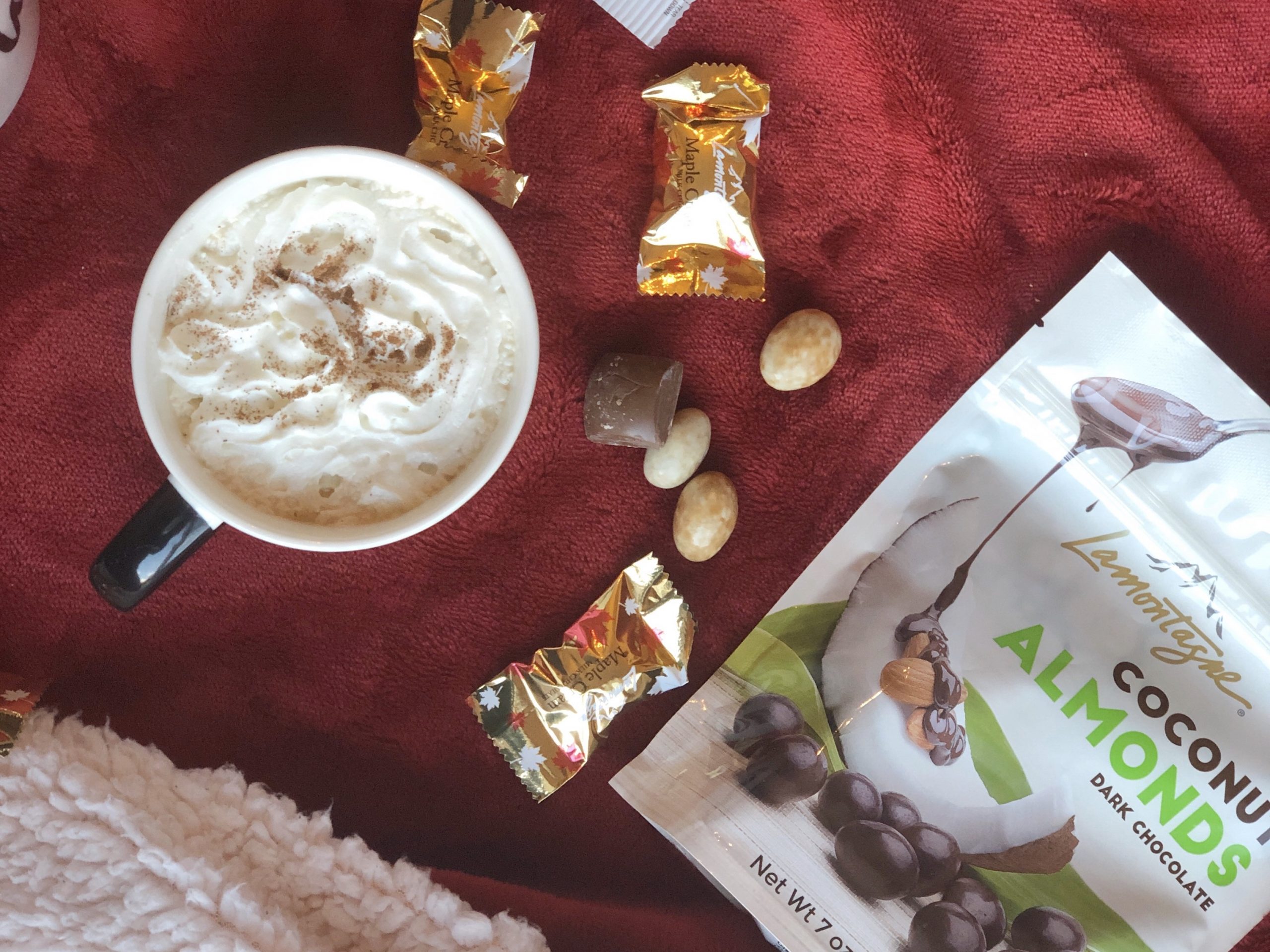 Coffee with whipped cream and chocolates