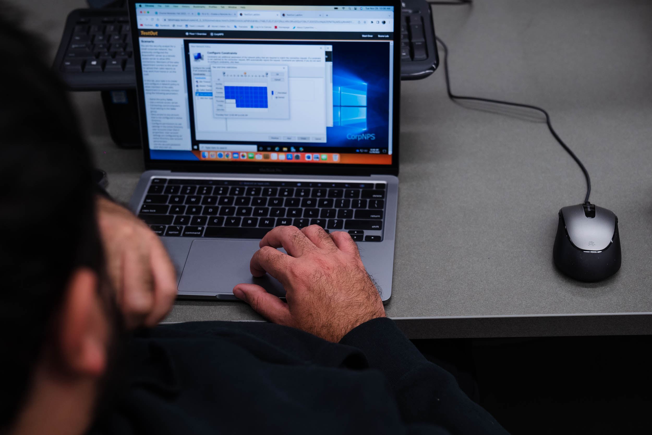 A student works on his computer during a cyber security class at San Diego City College on Nov. 29, 2022.