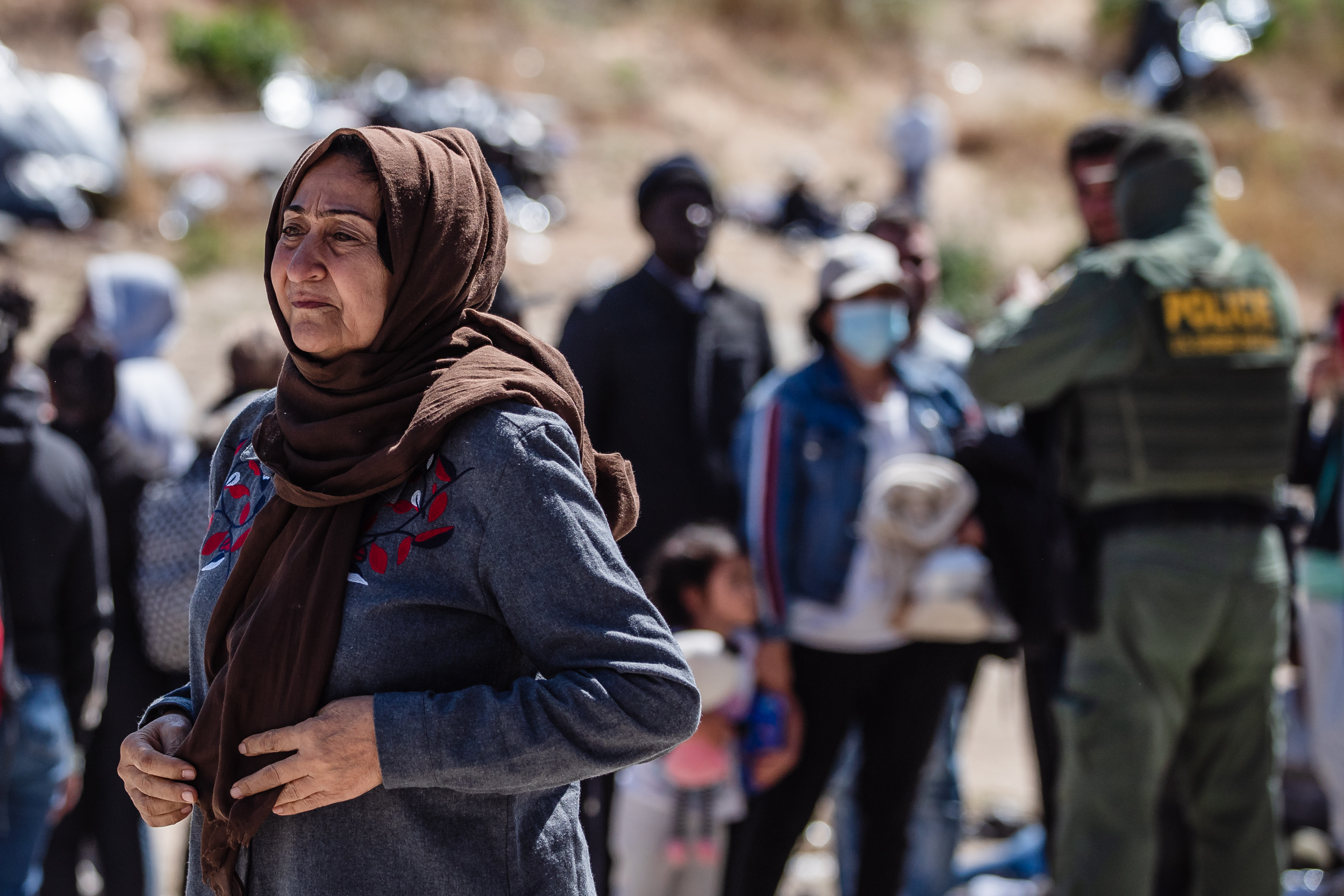 Asylum seekers wait at the US-Mexico border in San Ysidro on May 9, 2023.