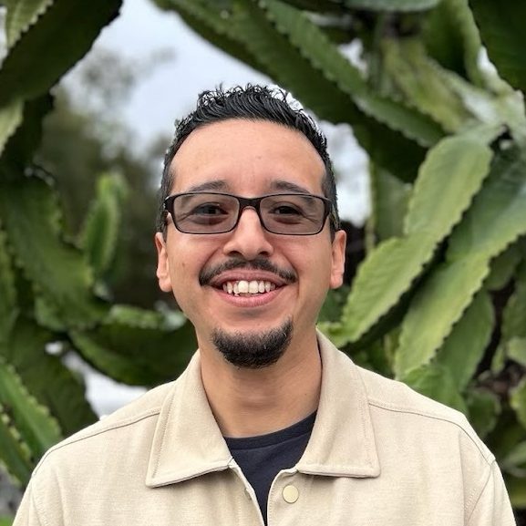 Juan Estrada standing in a yard