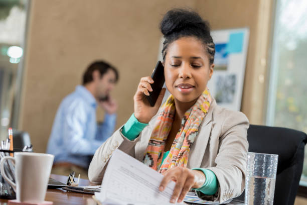 A woman screening an applicant via phone
