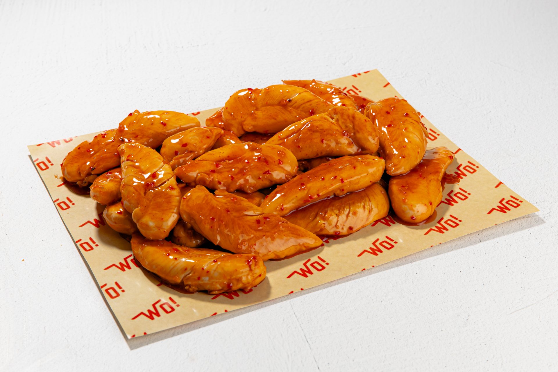 Golden-brown grilled chicken tenders, perfectly juicy and tender. They are covered in sweet and spicy sauce, giving the chicken tenders a refreshing sweet kick.