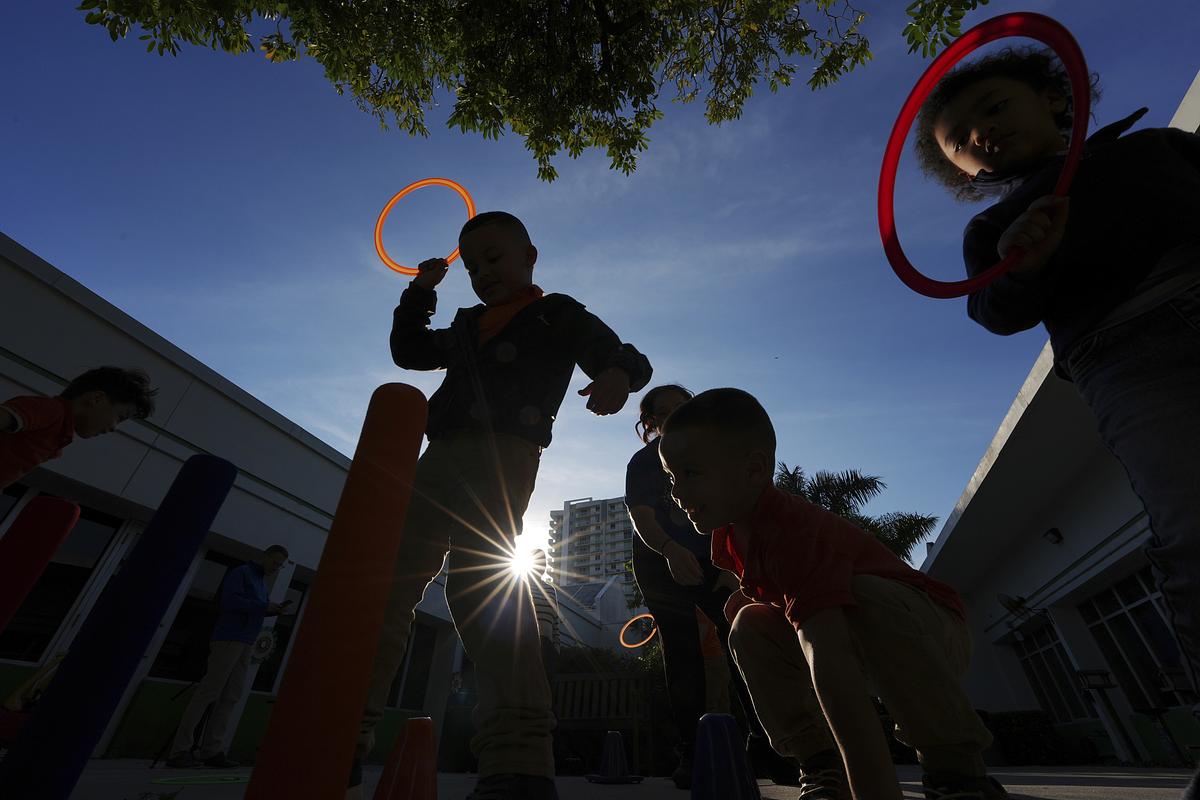 Children playing in silhouette