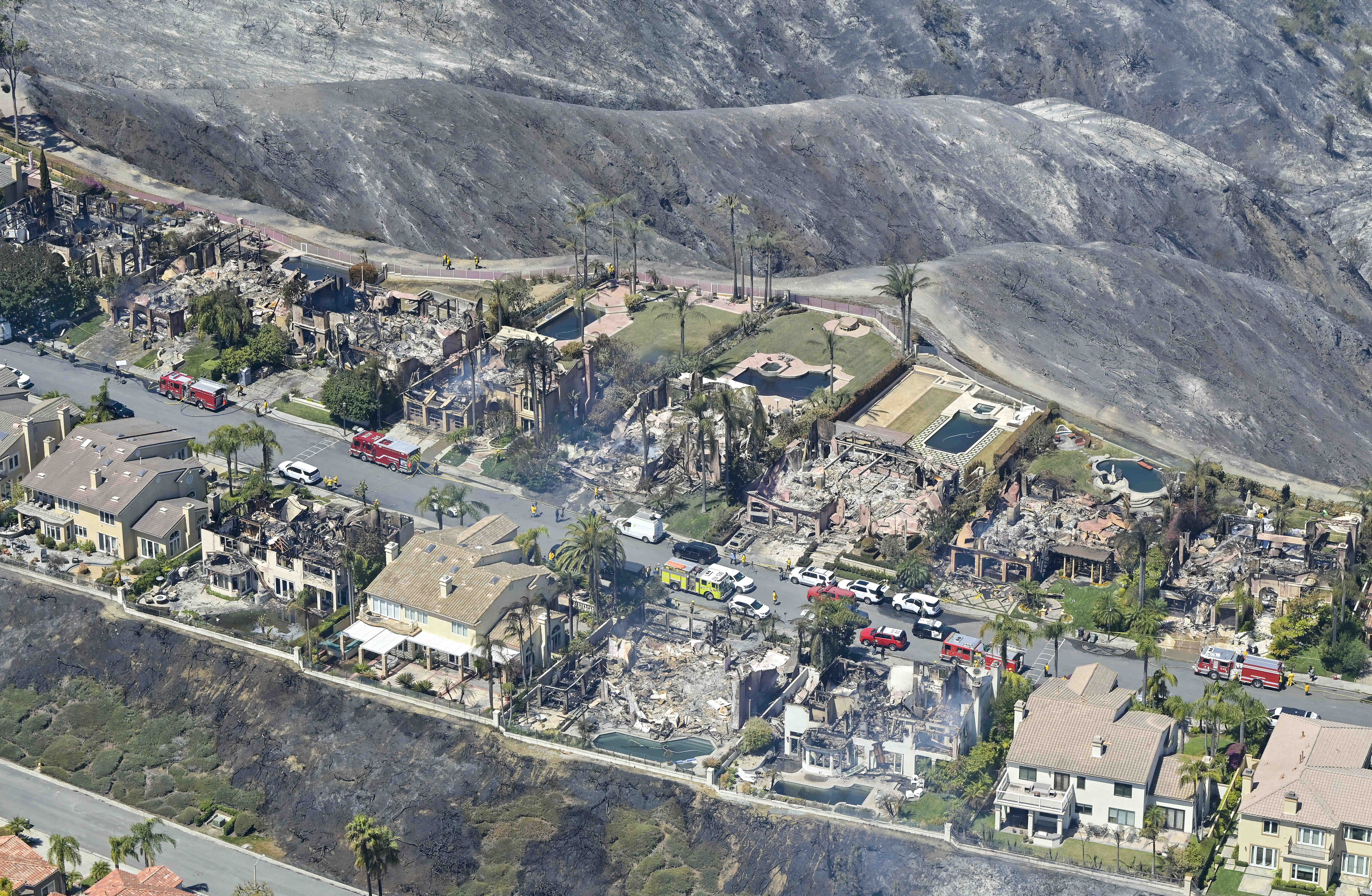 Home are destroyed after the Coastal Fire moved through Laguna Niguel, CA, on Thursday, May 12, 2022. At least 20 homes were destroyed when the brush fire ripped through the coastal Orange County community. (Photo by Jeff Gritchen, Orange County Register/SCNG)