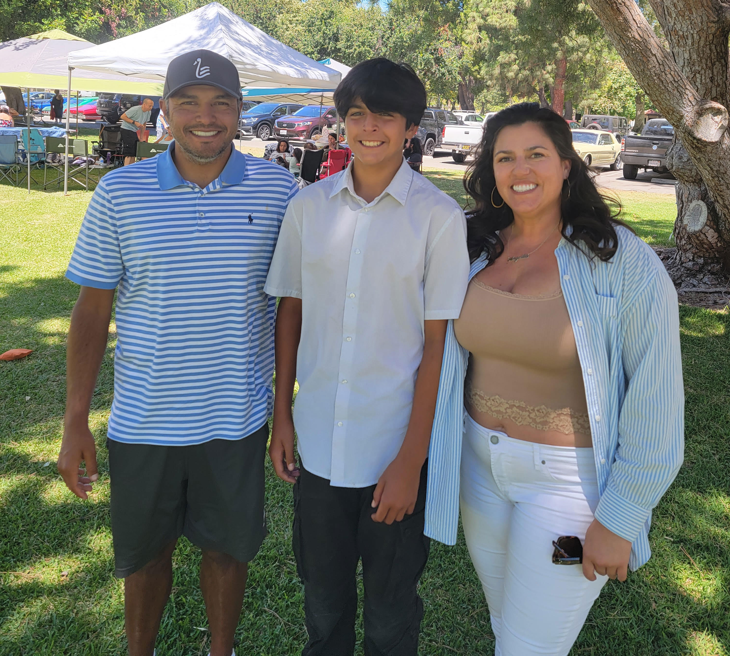 Angelita White, 40, with her husband and son, Julian and David Gaitan. The family spent more than $200 in tenant screening fees when shopping for an apartment. "If I tried to give them my own credit report, ... they would say no, we only accept it through this portal," White said. (Photo courtesy of Angelita White)
