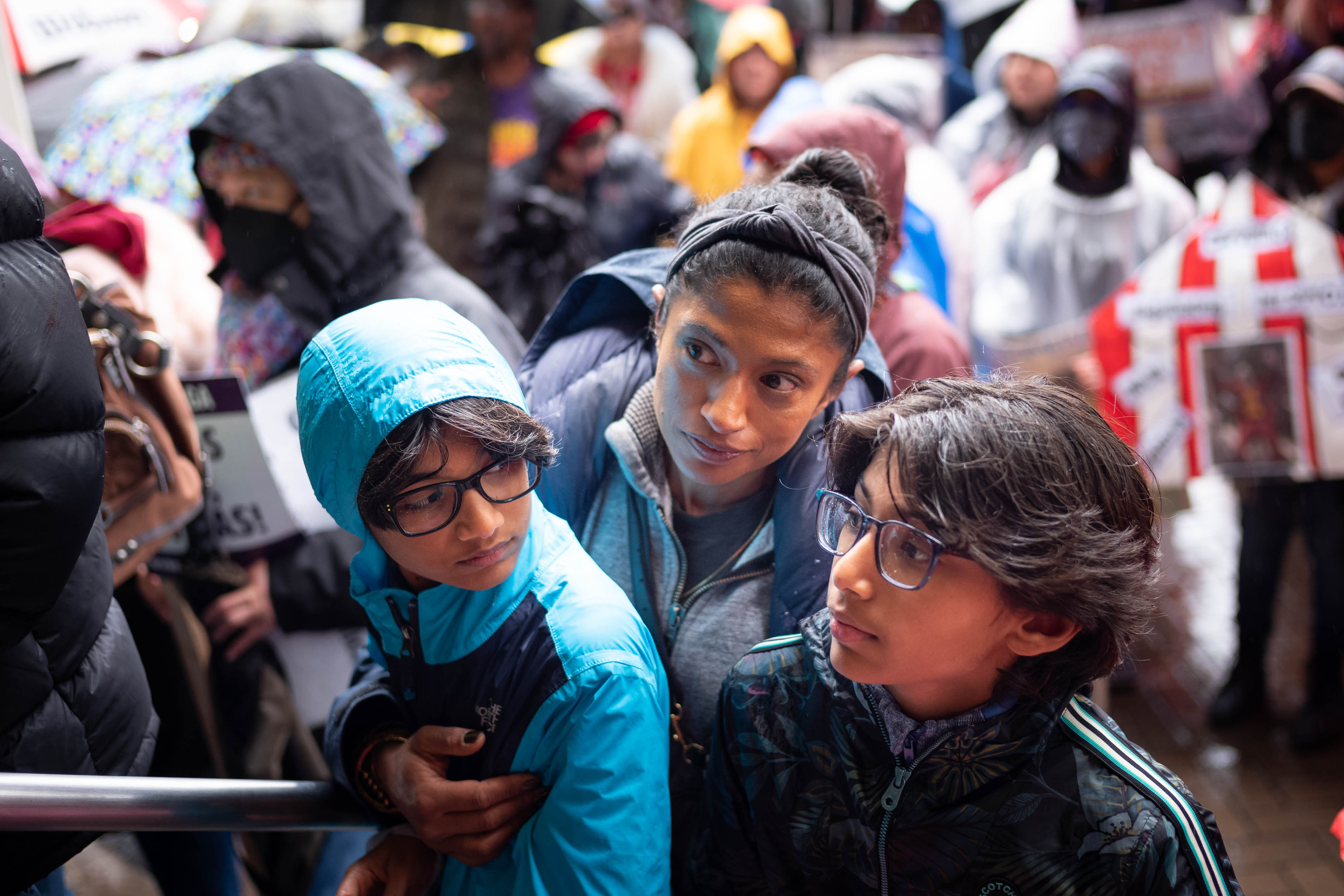 Nirupa Shaw and her sons Odie and Robbie, students at the Center for Early Education, attend a protest with SEIU workers, LAUSD teachers, and students outside the LAUSD headquarters in Los Angeles Wednesday, March 22, 2023.
