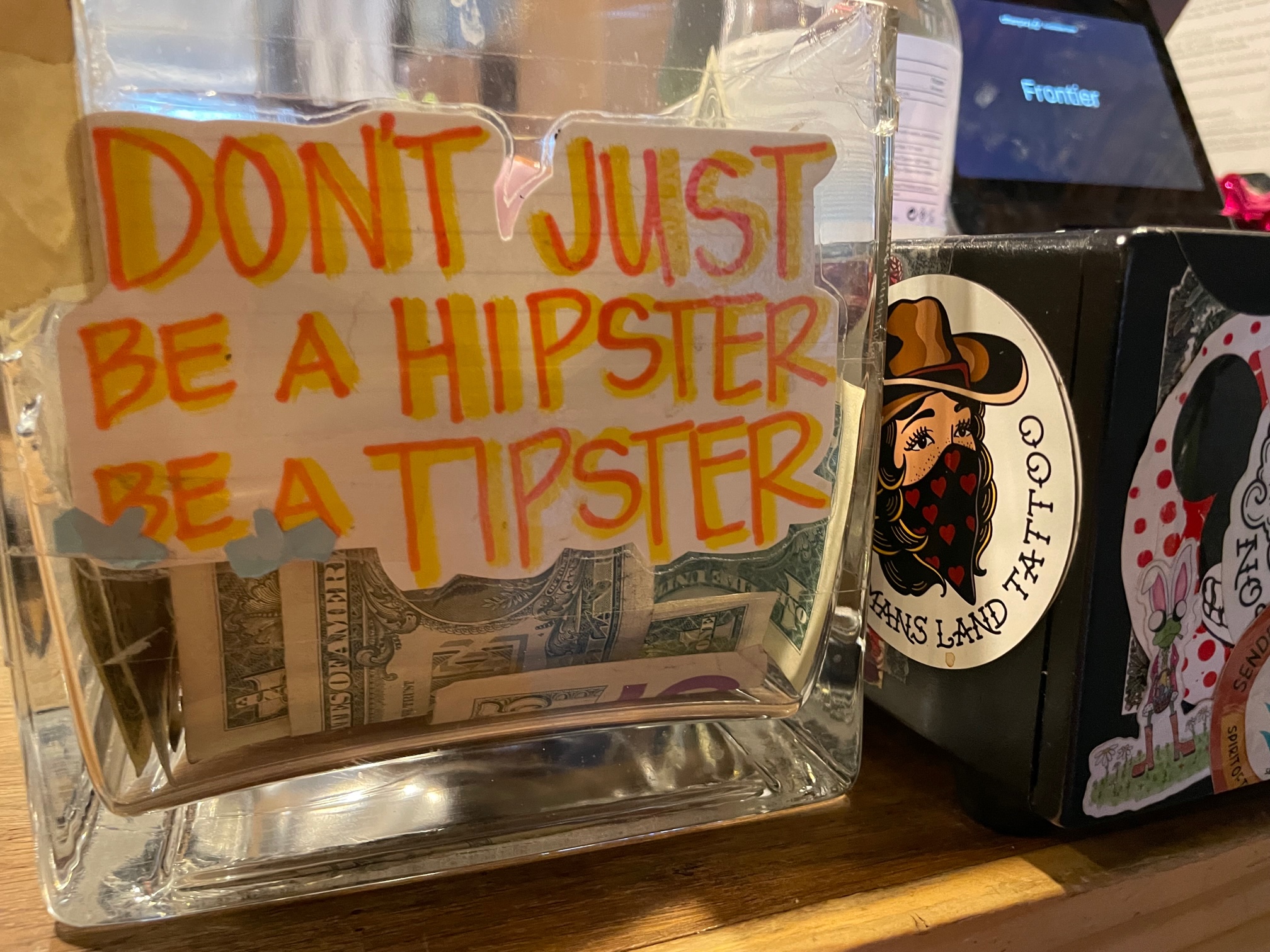 The tip jar at this Yucca Valley restaurant makes a point to tourists, but in a humorous way. Based on the cash inside, it seems to be effective. (Photo by David Allen, Inland Valley Daily Bulletin/SCNG)