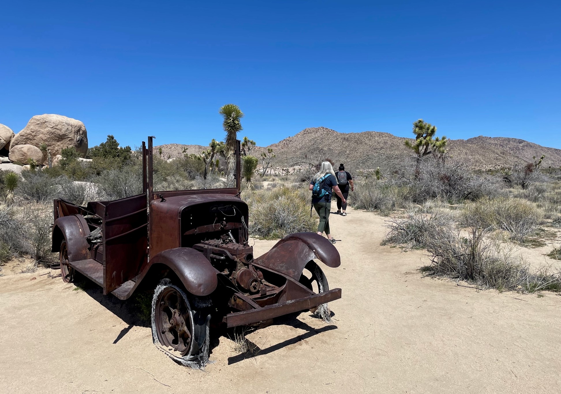 At Joshua Tree National Park, the path to the Wall Street Mill, named either self-mockingly or hopefully by its founders nearly a century ago, takes hikers past a rusted wreck. (Photo by David Allen, Inland Valley Daily Bulletin/SCNG)