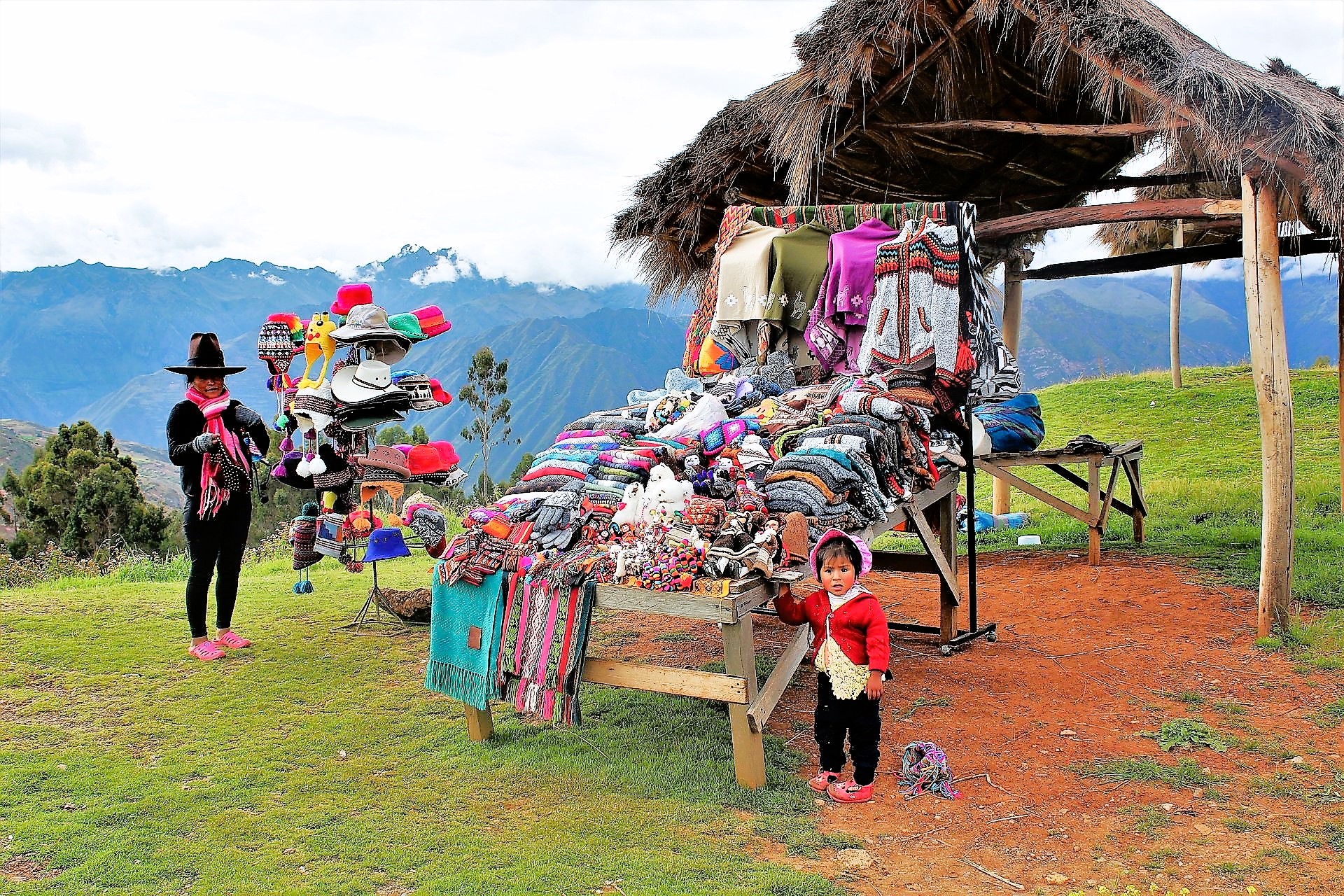 A Peruvian mother and child sell wares near the fertile Sacred Valley. (Photo by David Dickstein)