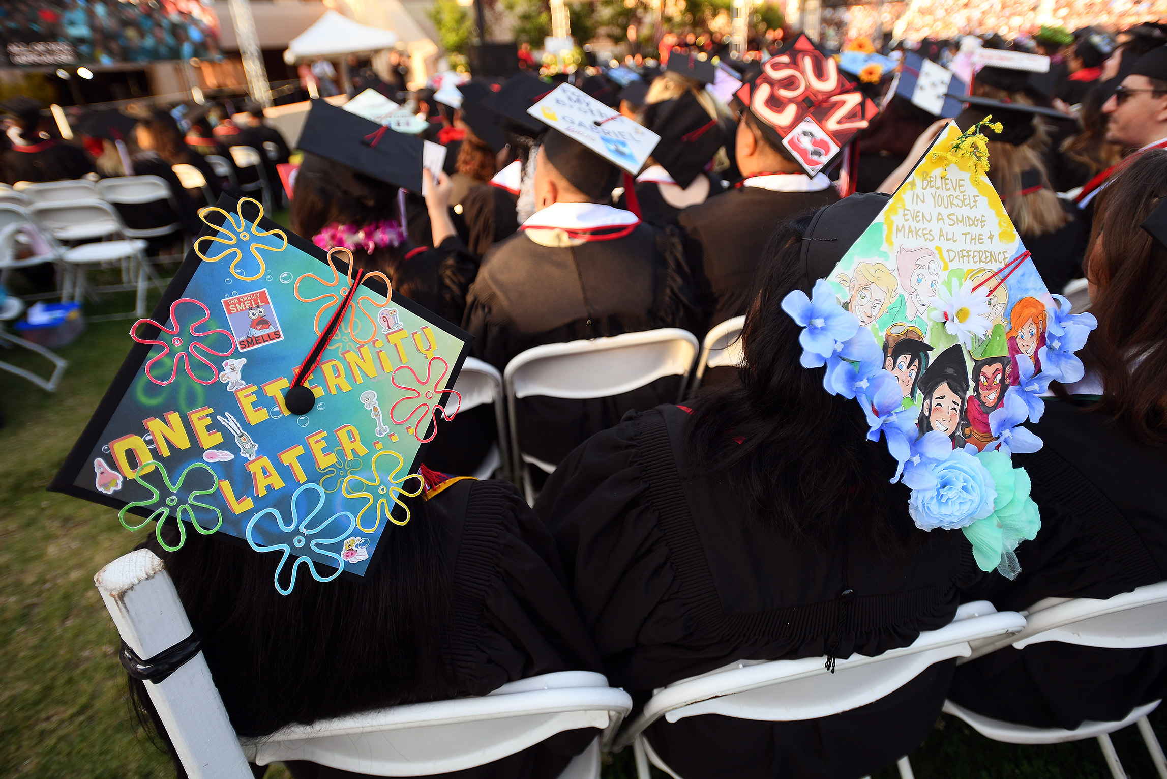 Decorated graduation caps are worn by graduates during the Mike Curb College of Arts, Media and Communications commencement ceremony at California State University, Northridge May 22, 2023.(Photo by Andy Holzman, Contributing Photographer)