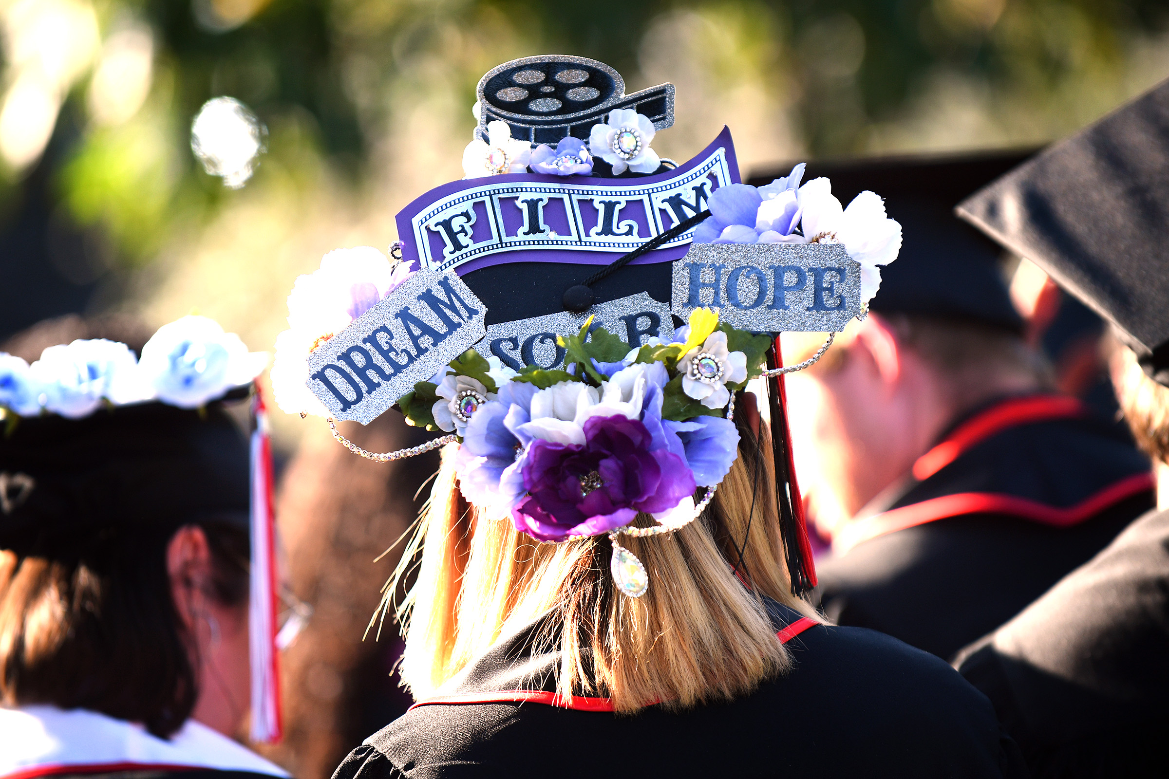 A decorated graduation cap is worn by a graduate during the Mike Curb College of Arts, Media and Communications commencement ceremony at California State University, Northridge May 22, 2023.(Photo by Andy Holzman, Contributing Photographer)