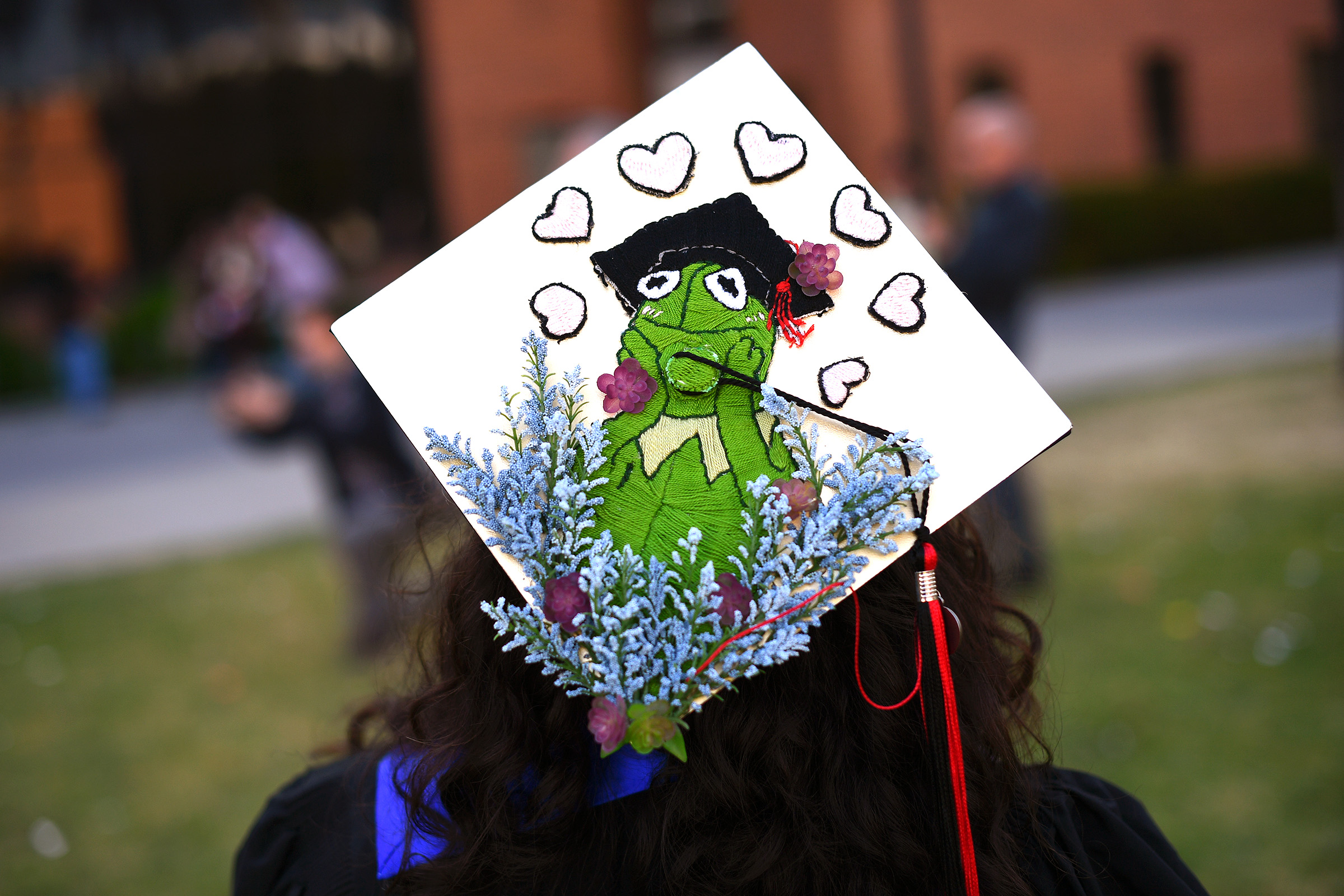A decorated graduation cap is worn by a graduate during the Mike Curb College of Arts, Media and Communications commencement ceremony at California State University, Northridge May 22, 2023.(Photo by Andy Holzman, Contributing Photographer)