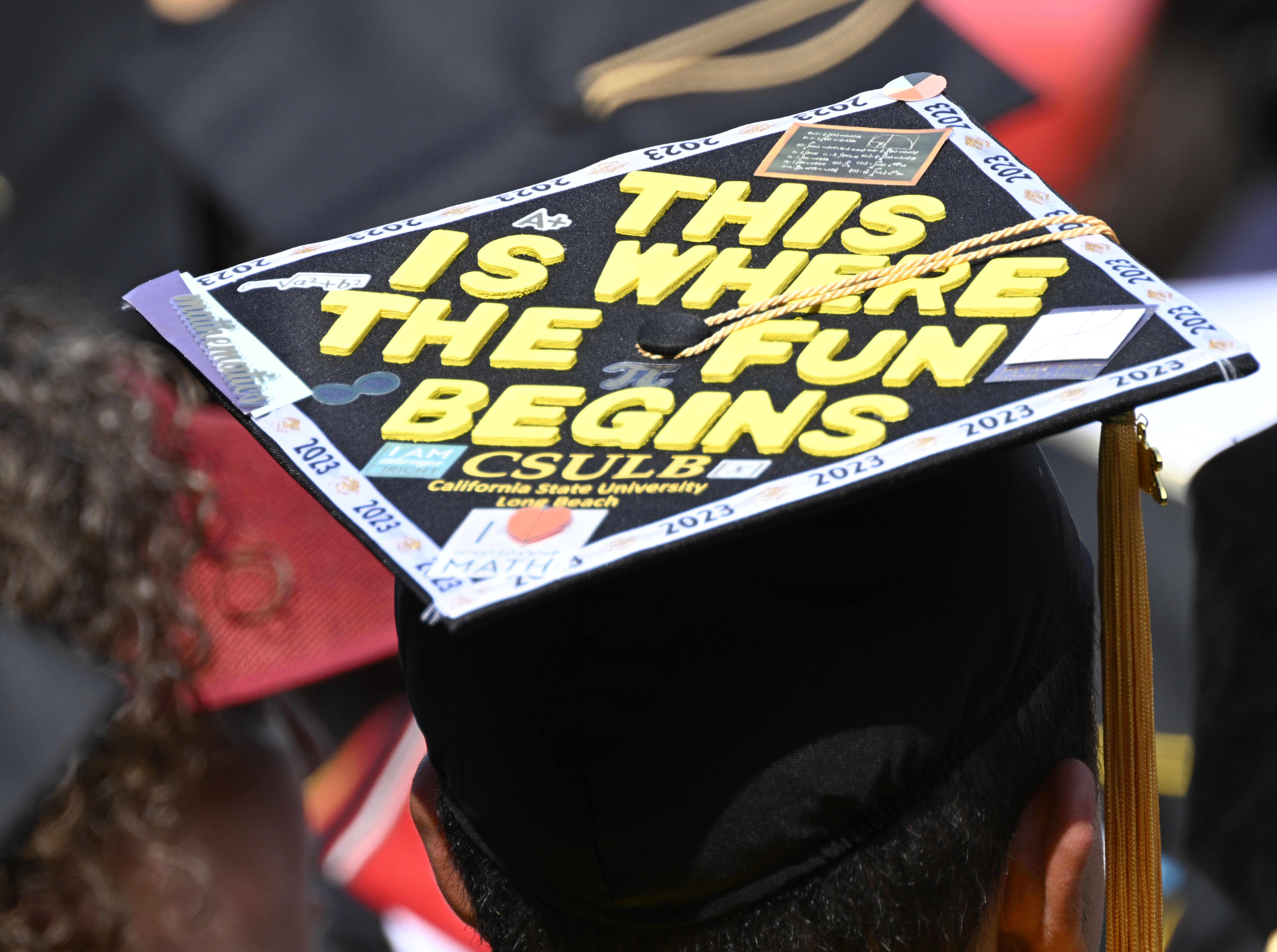 Many mortar boards were decorated in style for the College of Natural Sciences & Mathematics, graduation of California State University of Long Beach at Angel Stadium in Anaheim on Monday, May 15, 2023. (Photo by Brittany Murray, Press-Telegram/SCNG)