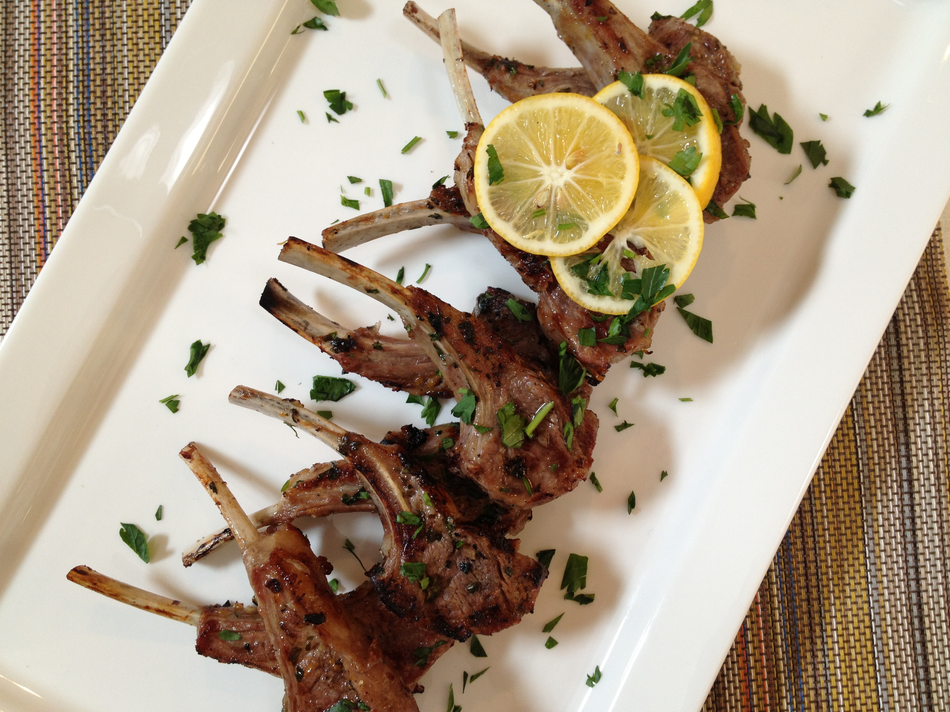 Lamb chops can be turned into delectable finger-food "lollipop" appetizers that you cook on the grill. (Photo by Curt Norris)