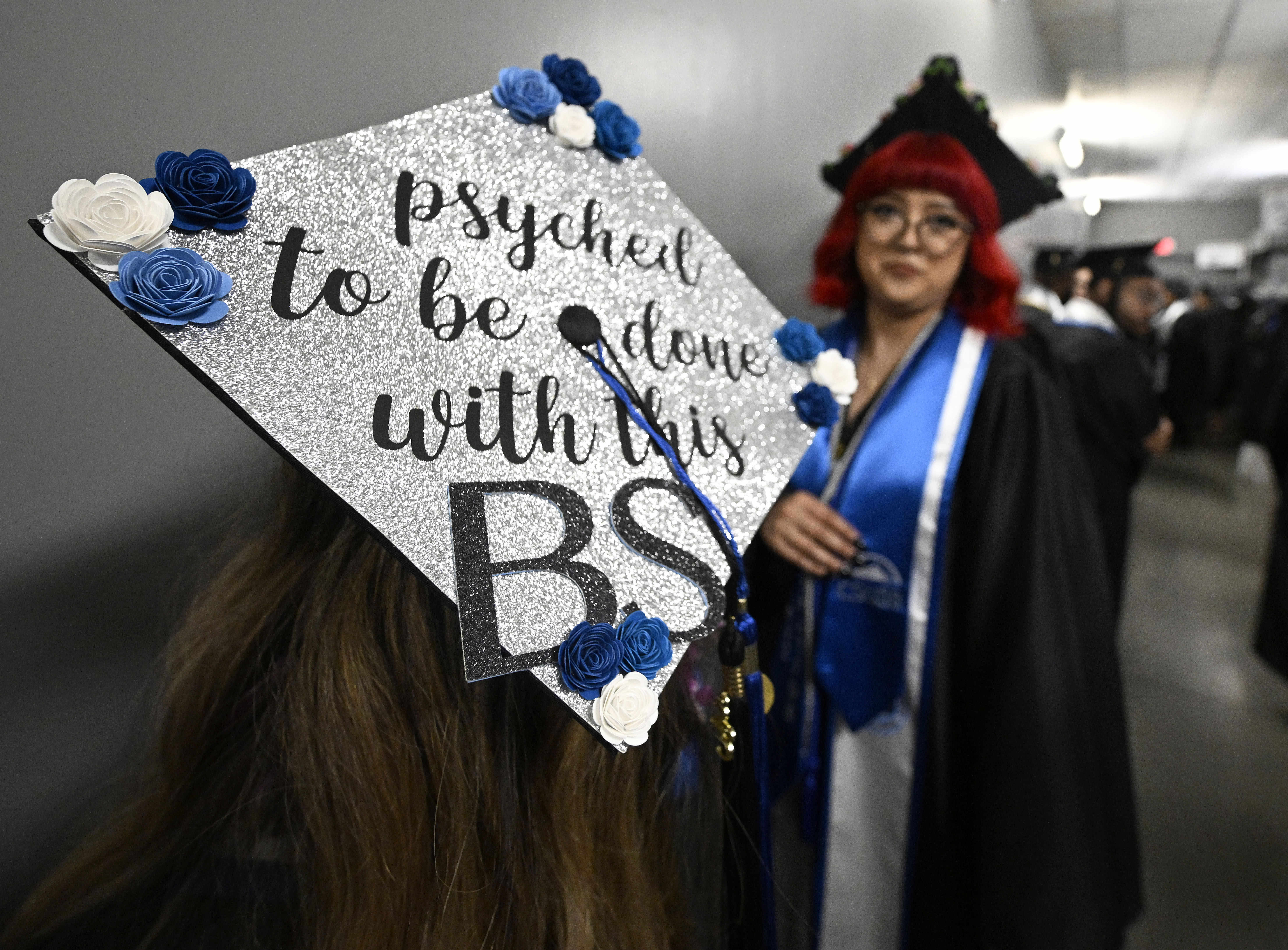 A California State University San Bernardino graduate waits in the hallway prior to the schools Spring 2023 Commencement at Toyota Arena in Ontario on Friday, May. 19, 2023. The commencement was the first of 5 to be held at the arena this weekend by the university. Approximately 3,500 students in all will receive Master and Bachelor of Arts degrees. (Photo by Will Lester, Inland Valley Daily Bulletin/SCNG)