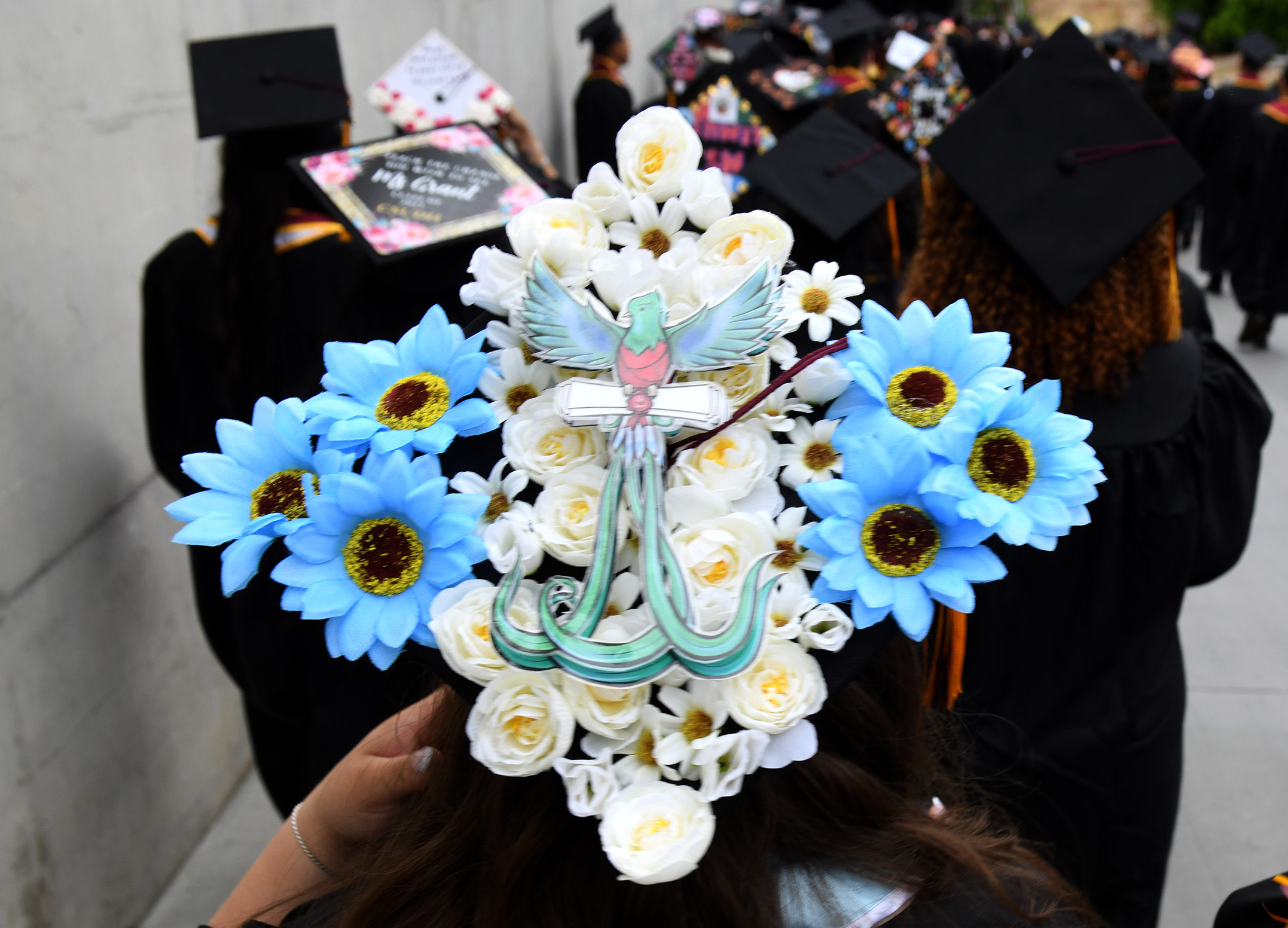 Students and their friends and families attend graduation ceremonies at the College of Arts and Humanities, and the College of Education at the Dignity Sports Health Park Tennis Stadium of Cal State Dominguez Hills on Friday day, May 19, 2023.(Photo by Axel Koester, Contributing Photographer)