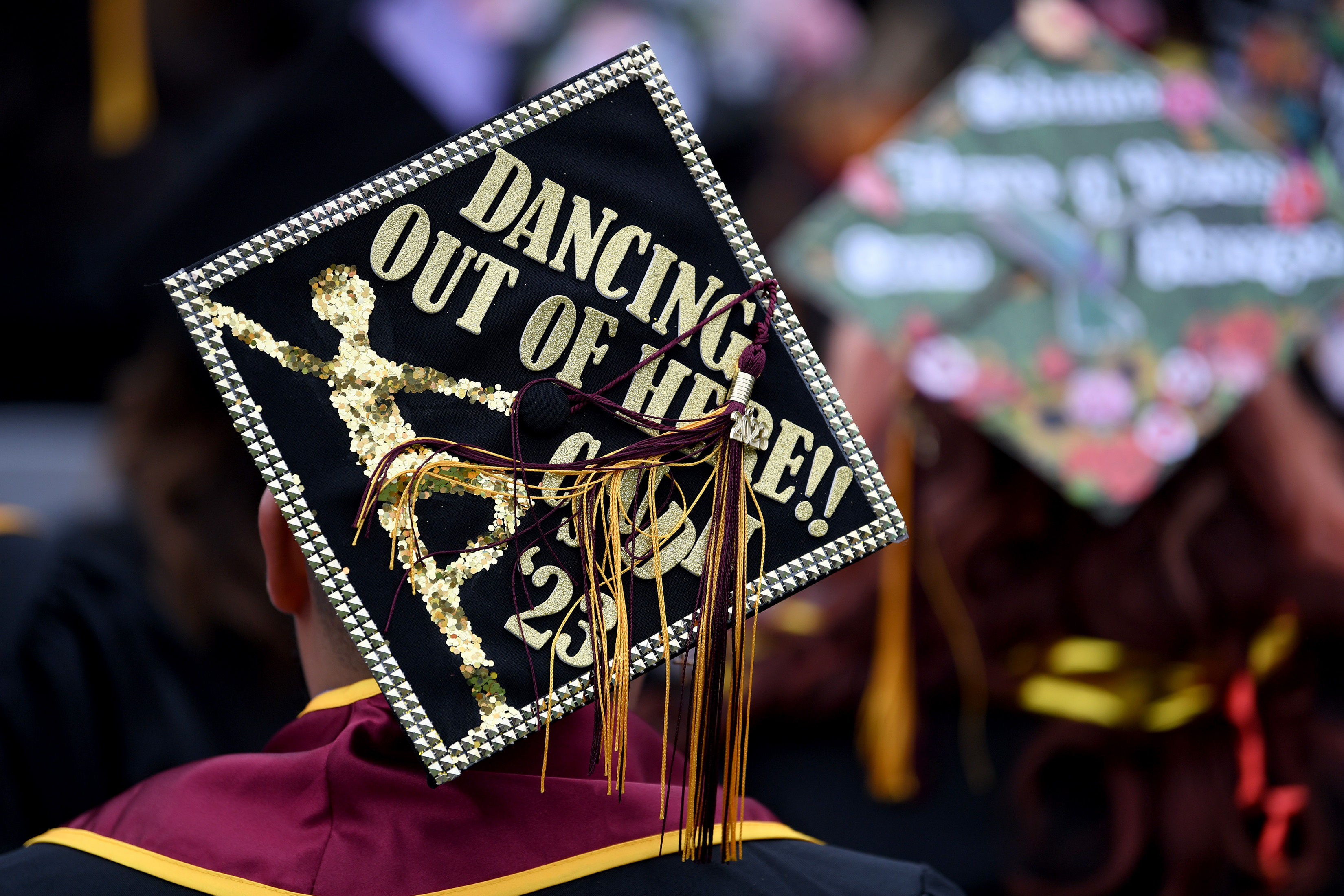 Students and their friends and families attend graduation ceremonies at the College of Arts and Humanities, and the College of Education at the Dignity Sports Health Park Tennis Stadium of Cal State Dominguez Hills on Friday day, May 19, 2023.(Photo by Axel Koester, Contributing Photographer)