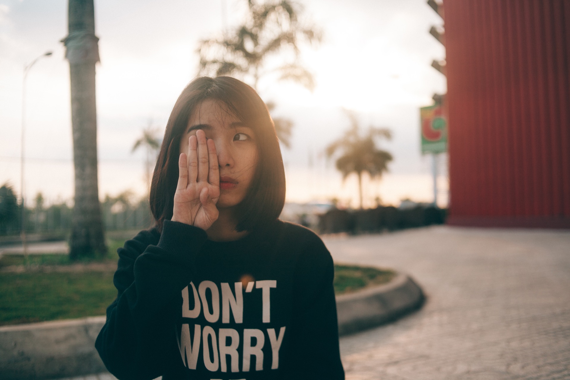 Girl with ADHD is anxious and wearing a don't worry sweatshirt