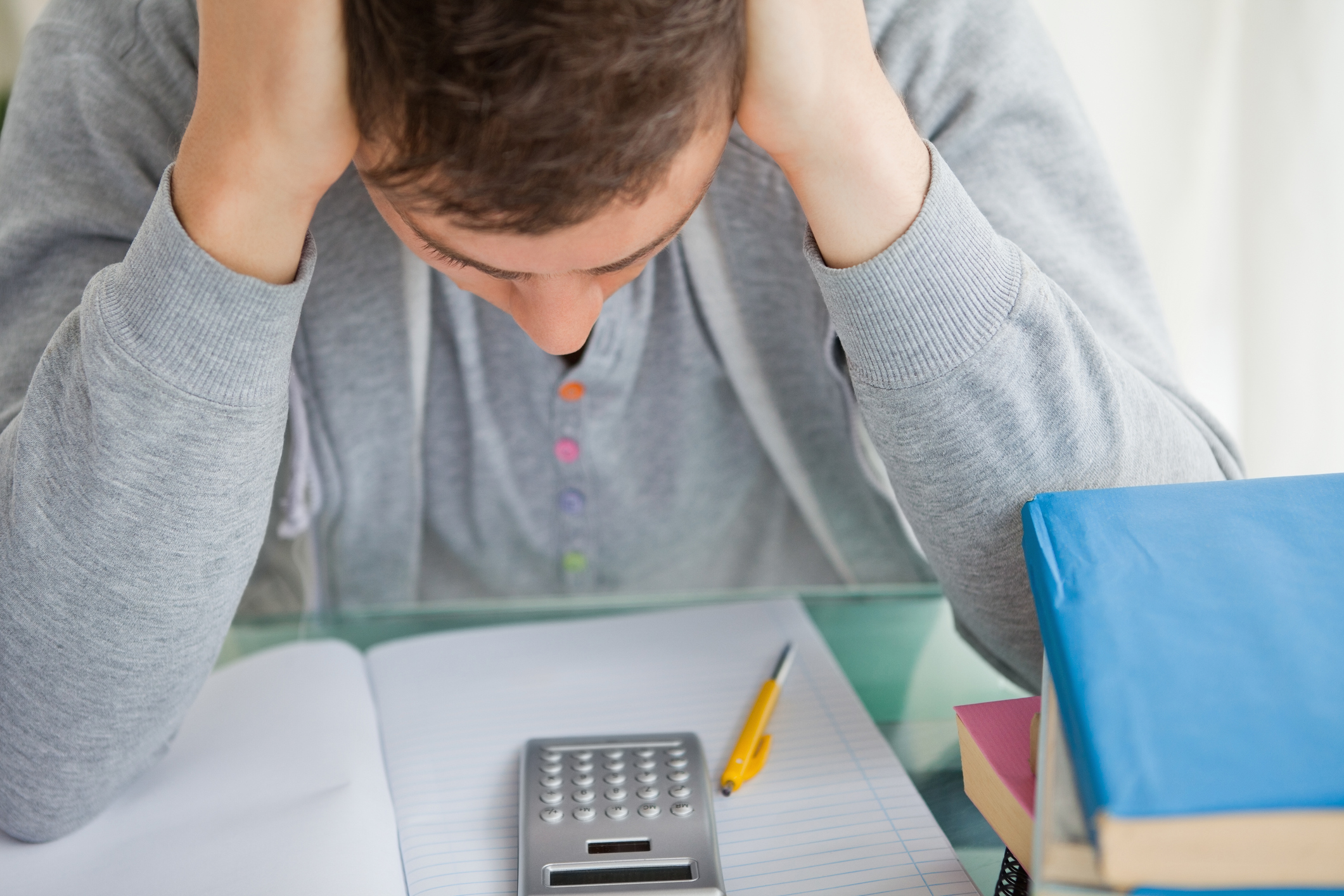 Dsycalculia in adults: A college student with ADHD and symptoms of dyscalculia is frustrated while working on a math assignment.