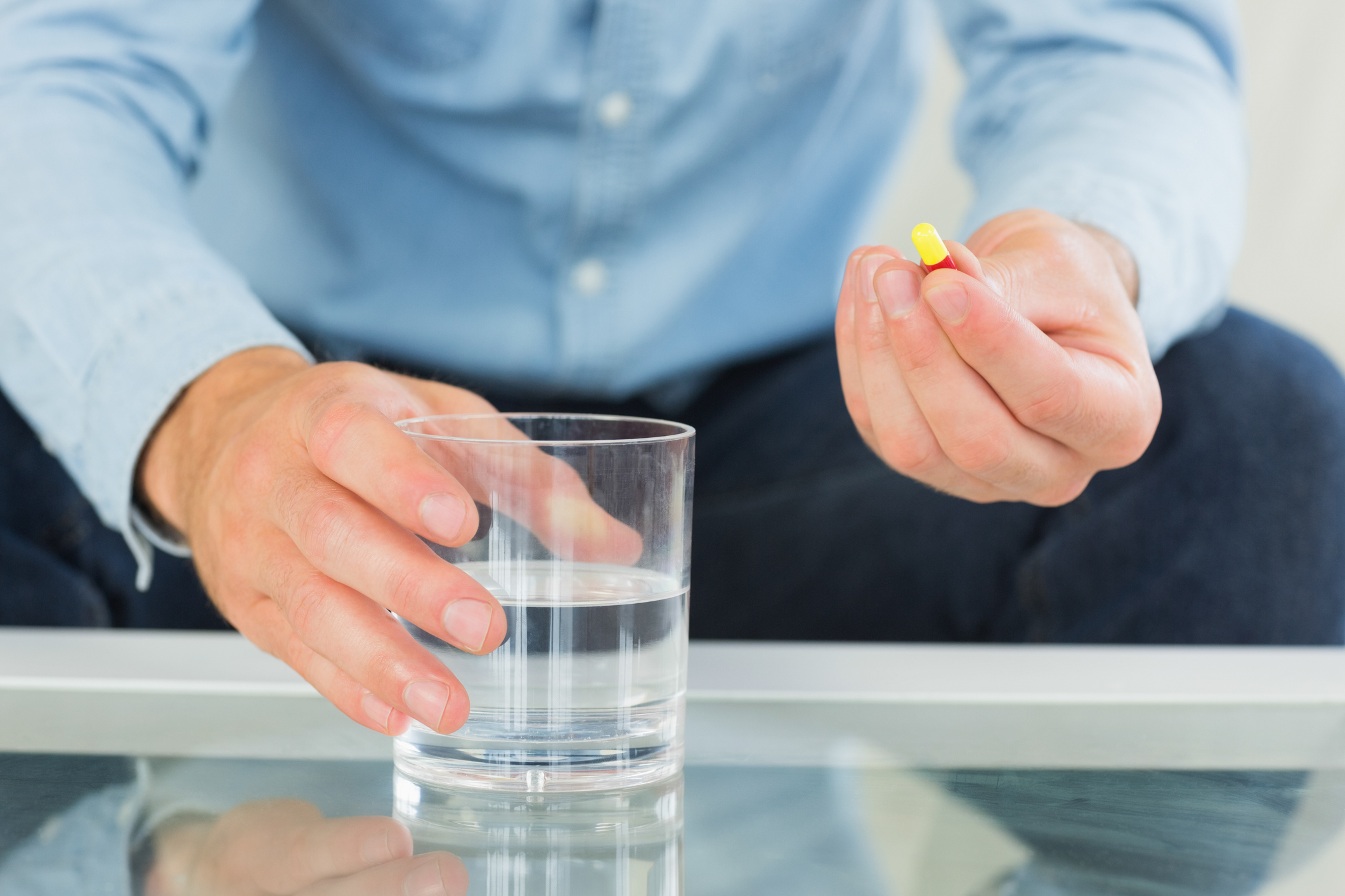 Man takes pills to treat his ADHD because medication works differently than CBT.